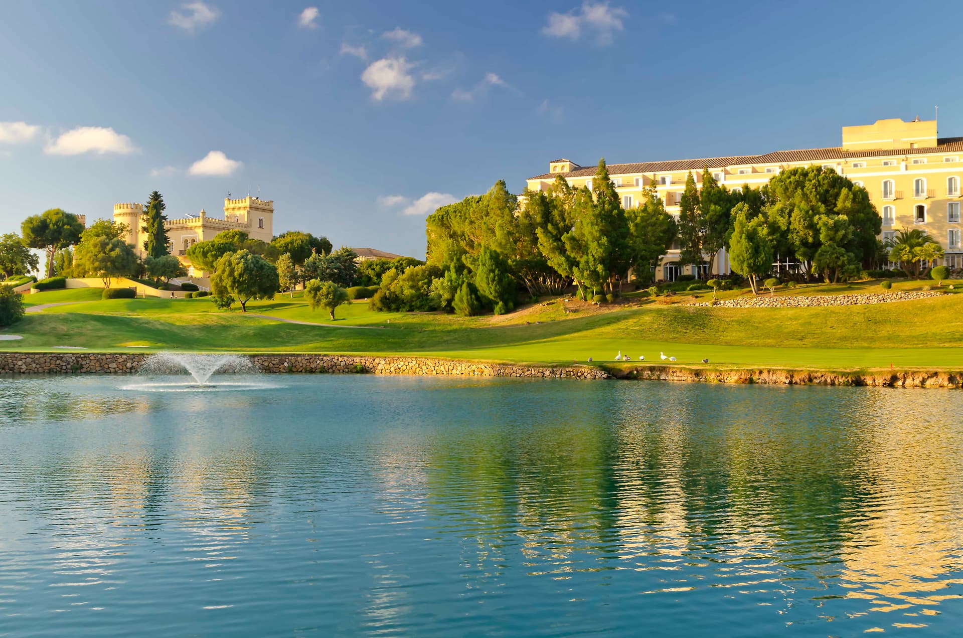 Water hazard (foreground) with the clubhouse and hotel in the background