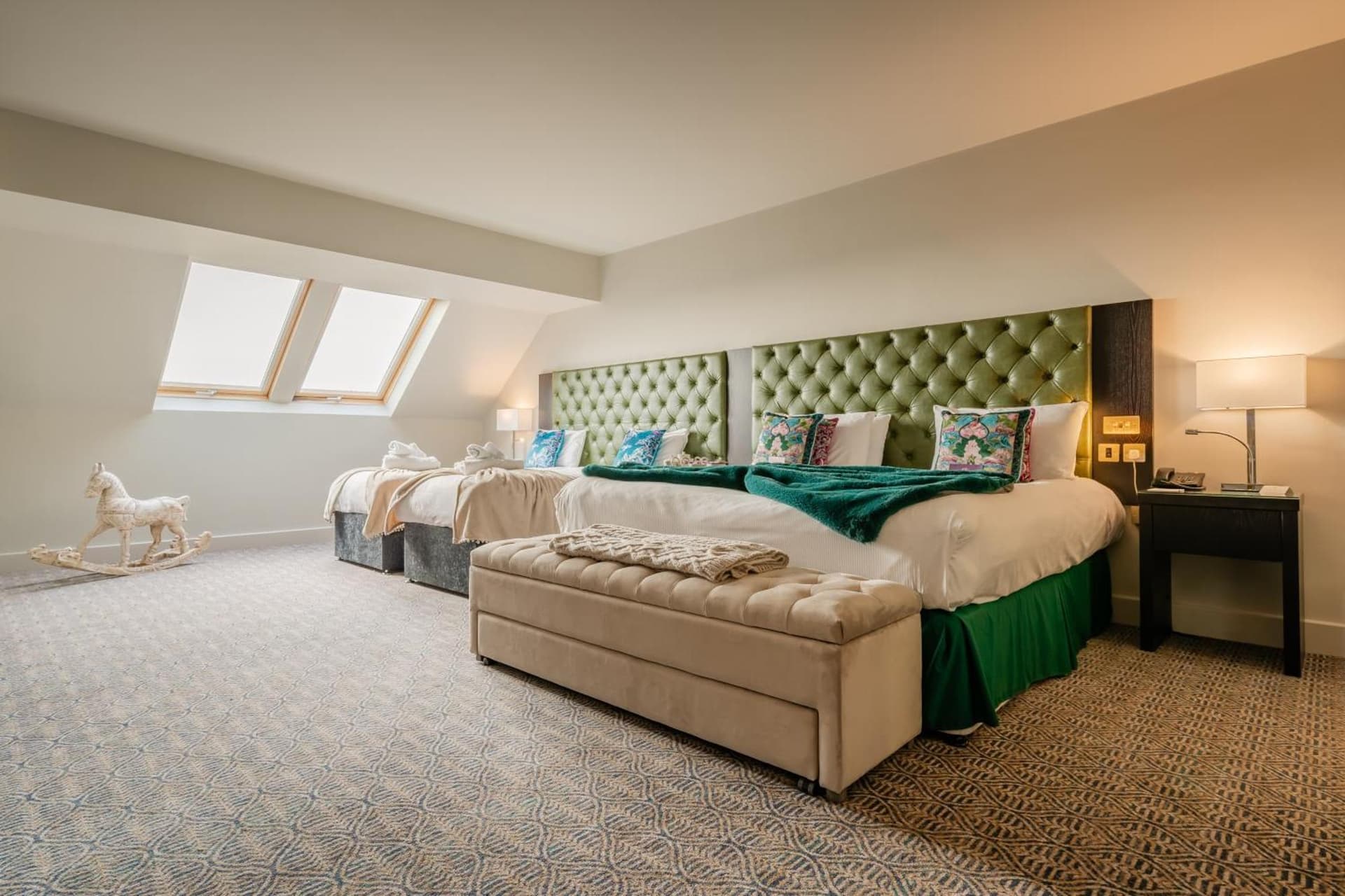 Room with King size bed and two twin beds