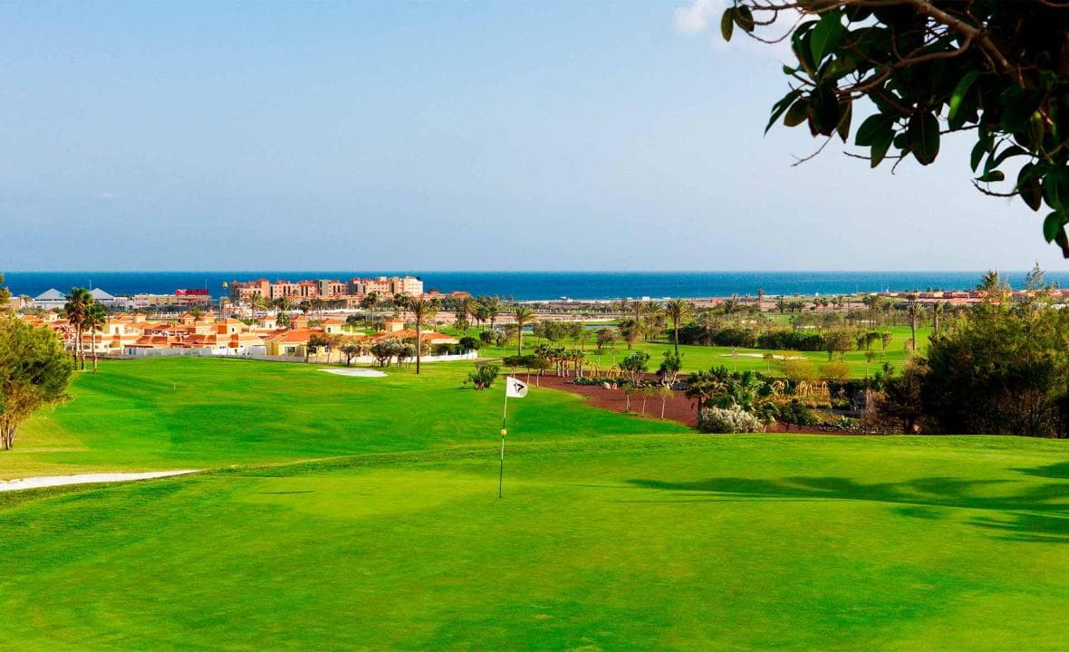 Elevated 17th green with a panoramic view of the resort and the ocean