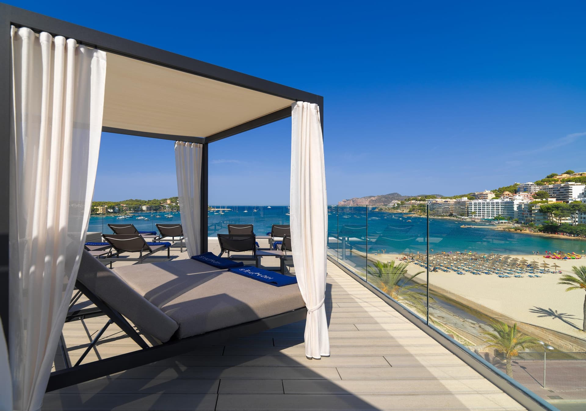 Balcony sunbeds with a view of the beach at H10 Casa Del Mar