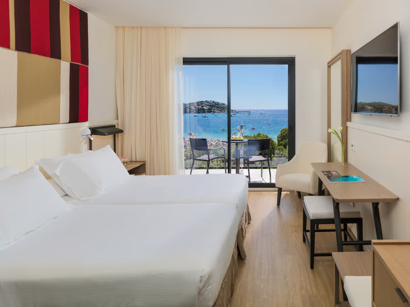 Double bed room at the H10 Casa Del Mar with balcony views of the ocean