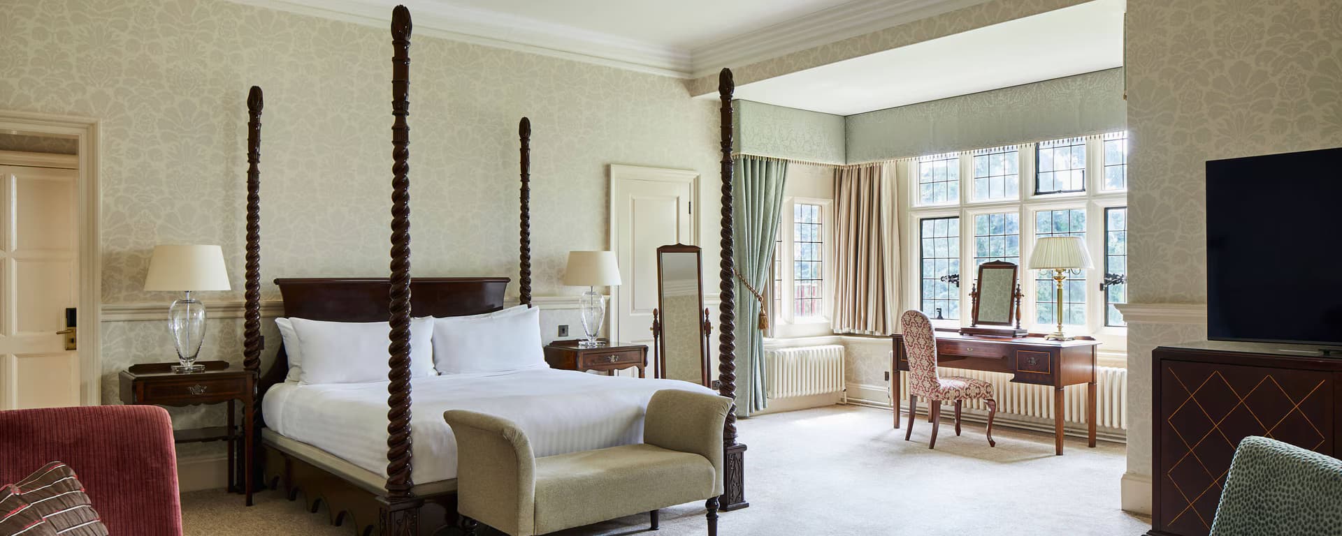 A grand double bed suite at the Hanbury Manor Hotel & Country Club