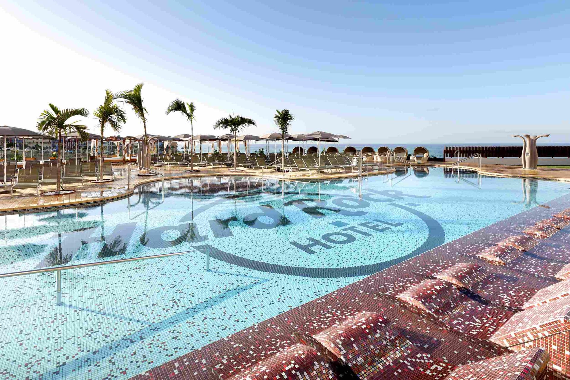 Outdoor swimming pool with the Hard Rock branding in the bottom of the pool