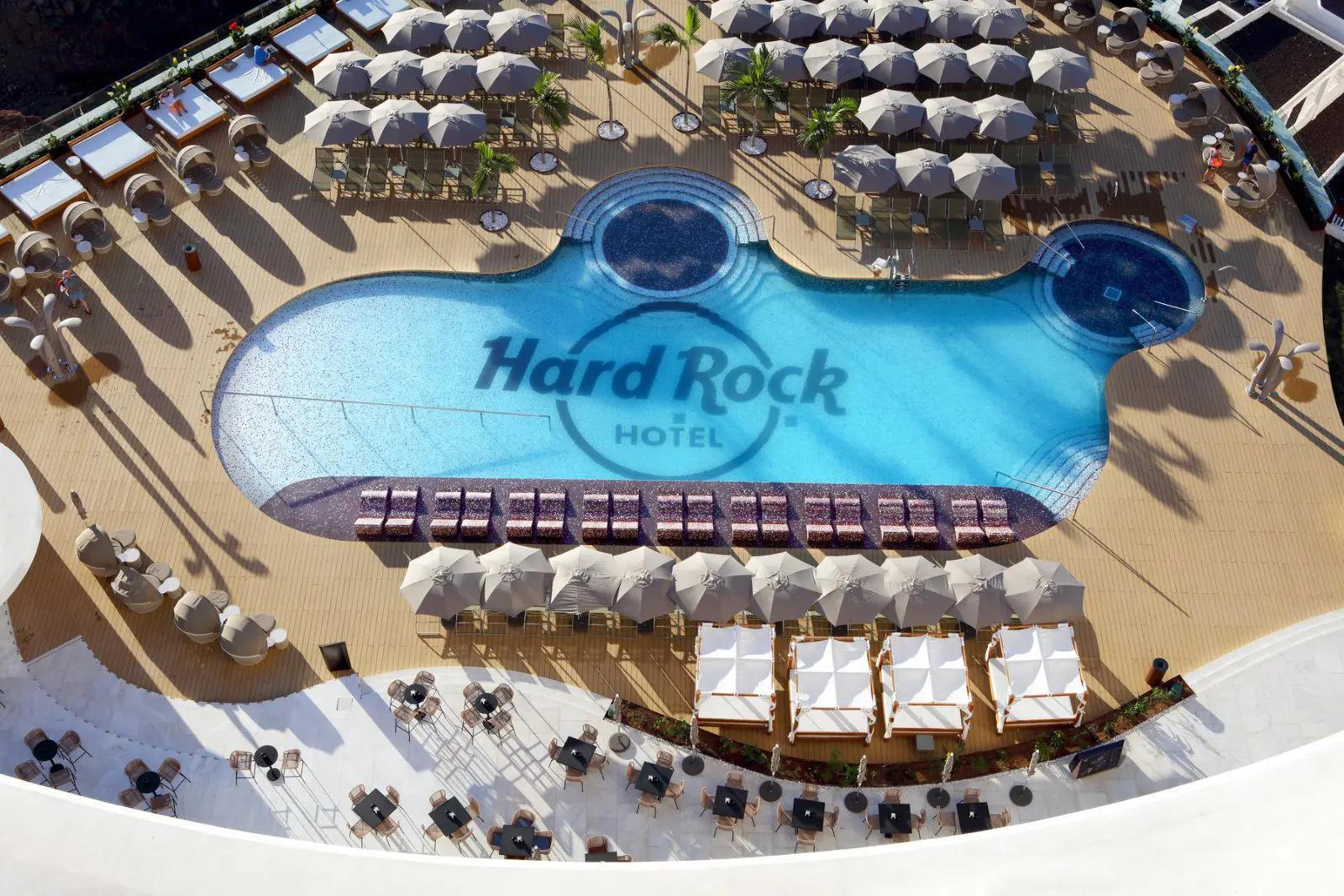 Aerial view of the Hard Rock Hotel Tenerife outdoor swimming pool with branding at the bottom