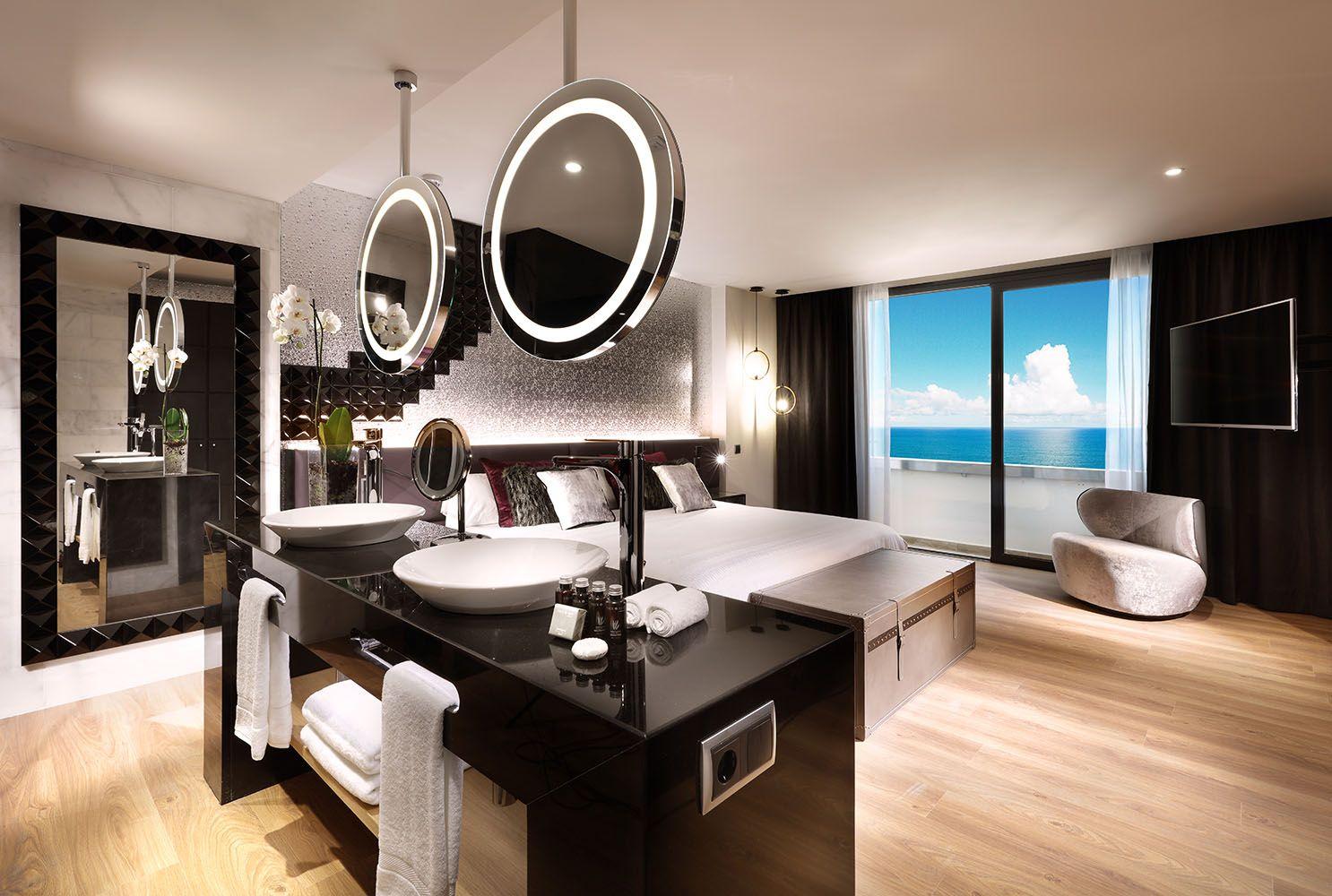 Double bed suite with open plan design and balcony views