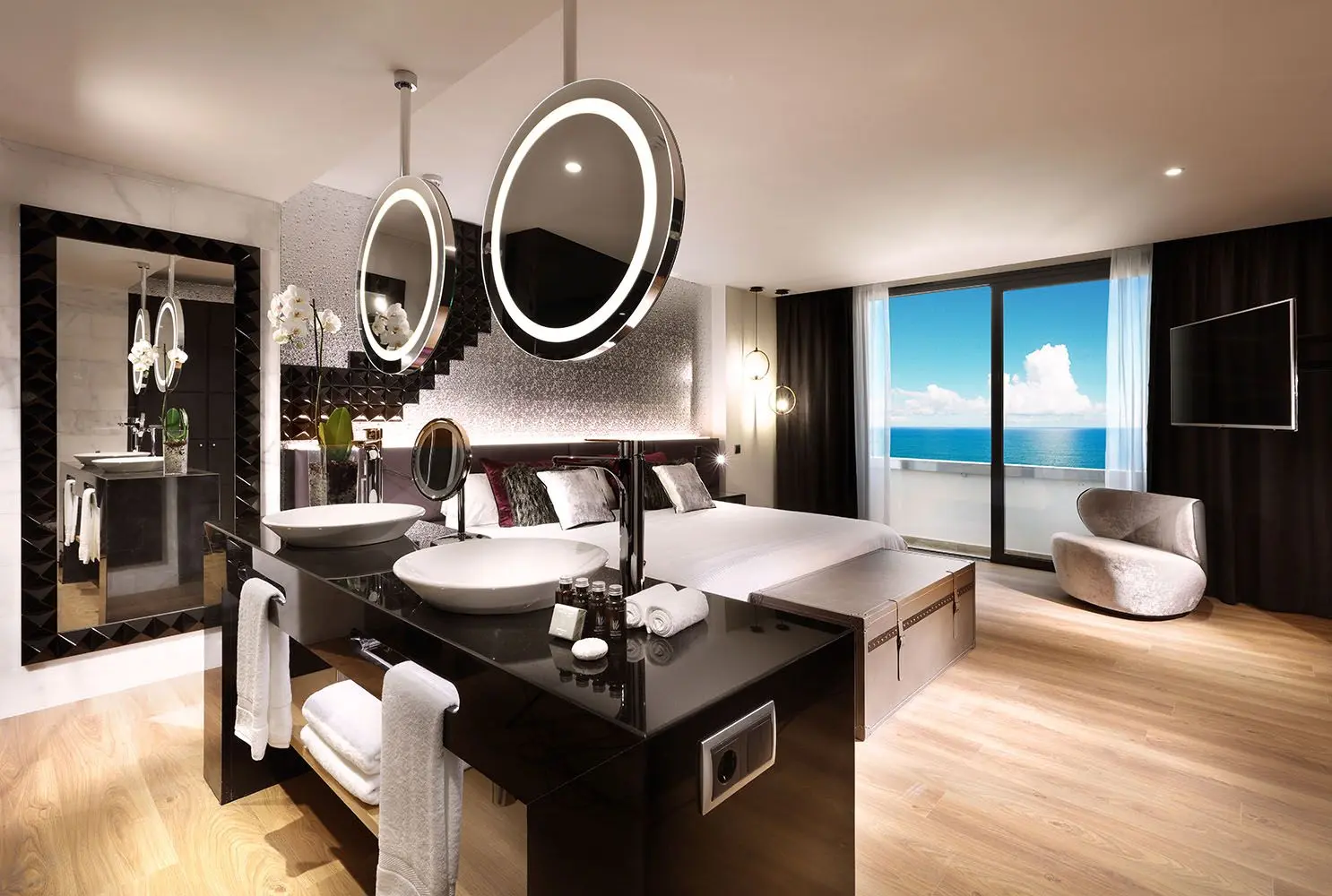 Double bed suite with open plan design and balcony views