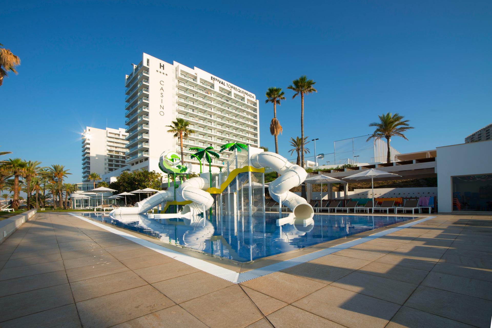 Panoramic view of Hotel Estival Torrequebrada overlooking the outdoor pool with a water slide