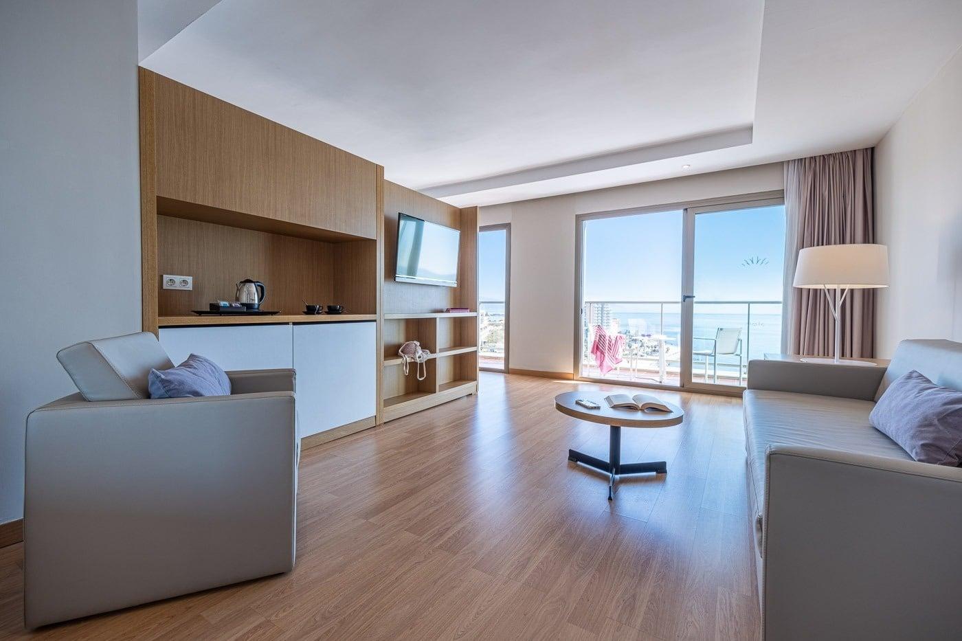 Living room and coastal balcony views as part of a suite at Hotel Estival Torrequebrada
