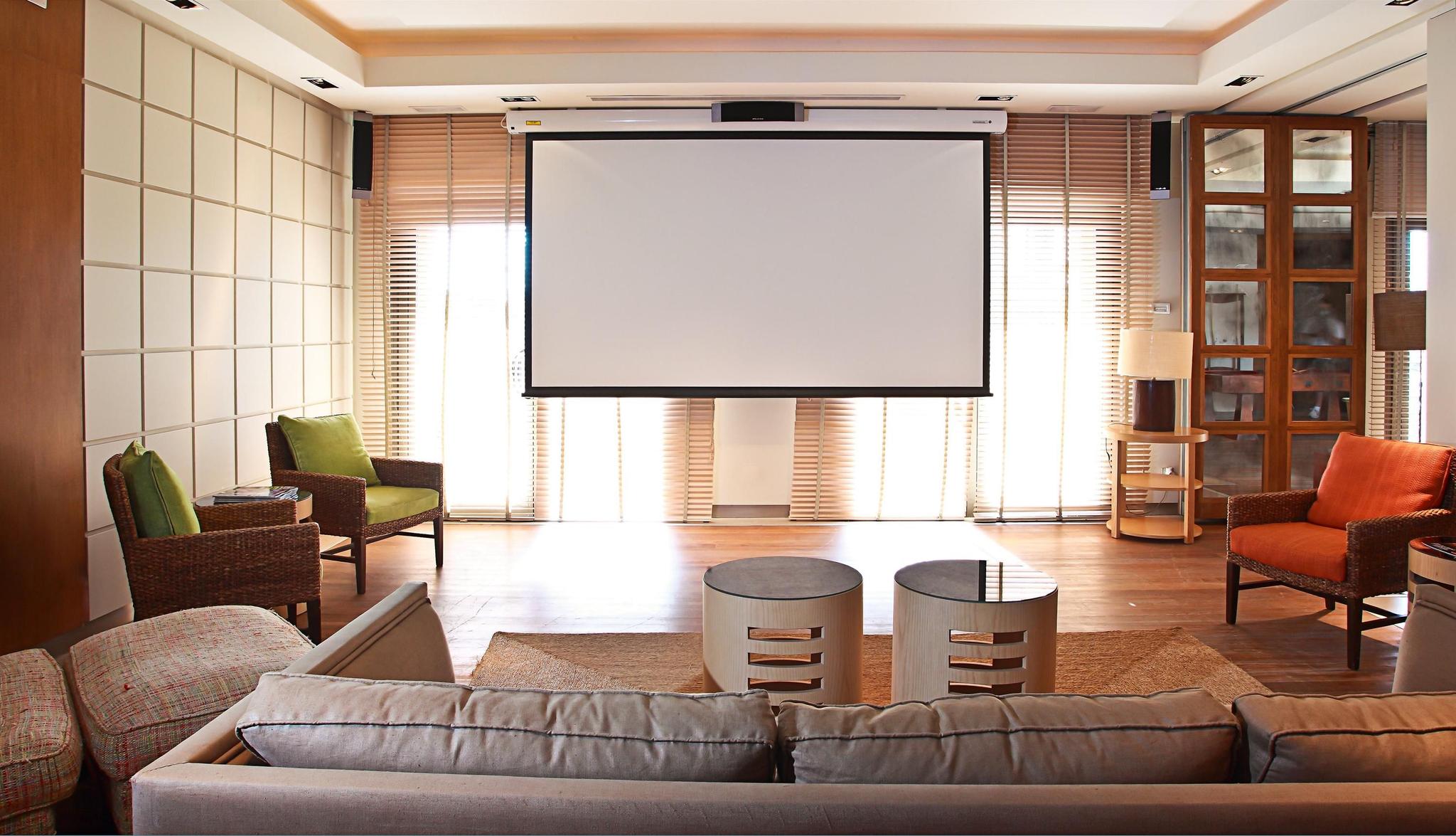 Lounging area with a projector at Hotel MiM Sotogrande Melia