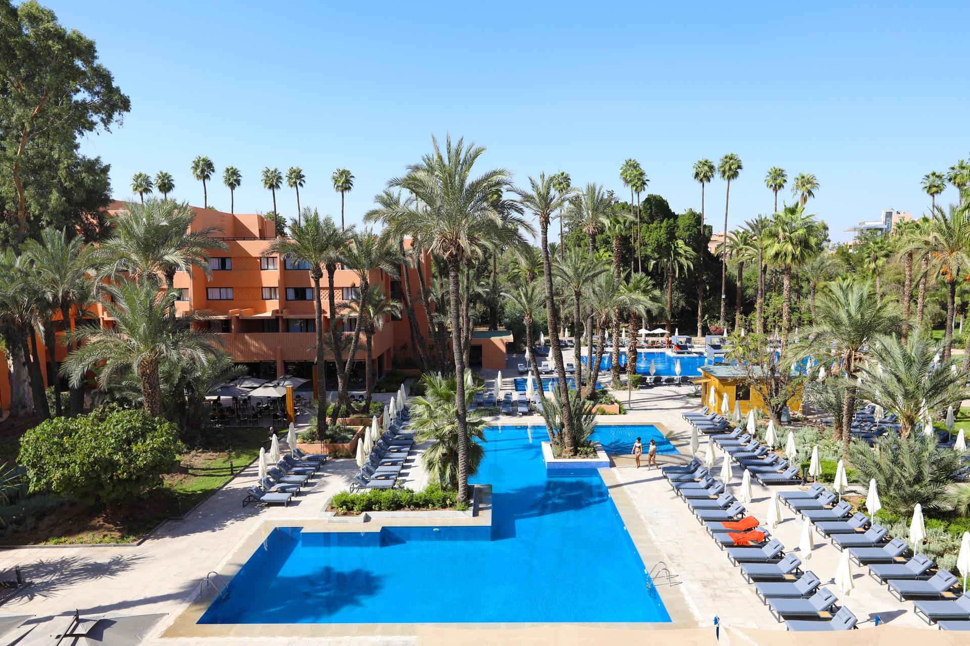 Overhead view of the outdoor swimming pool at Kenzi Farah Rose Garden
