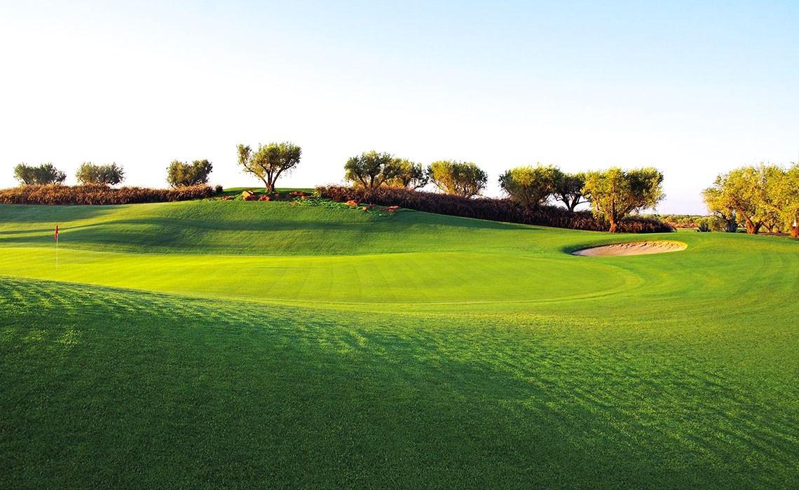 A well maintained fairway with a sand bunker
