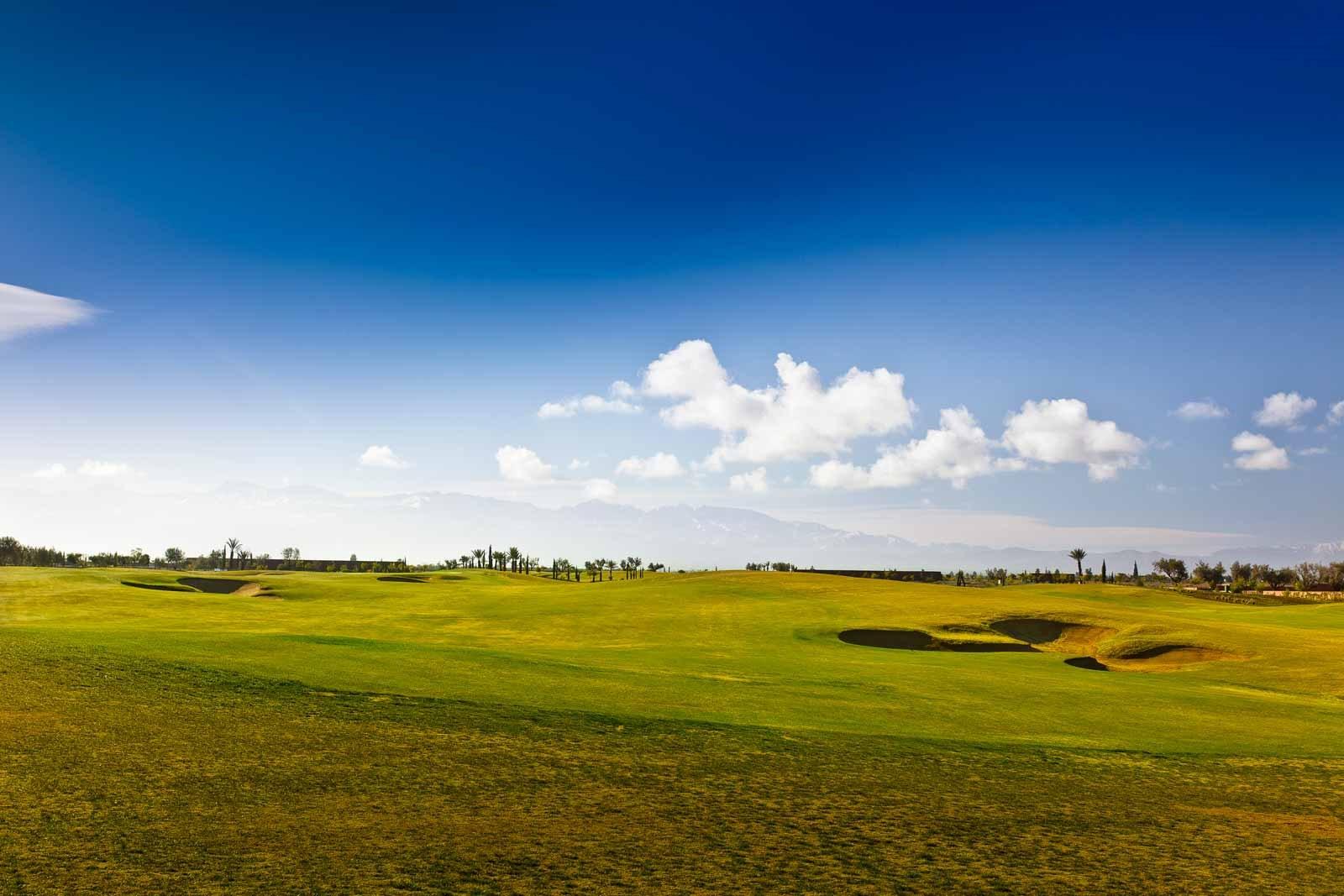 A well maintained fairway under blue skies