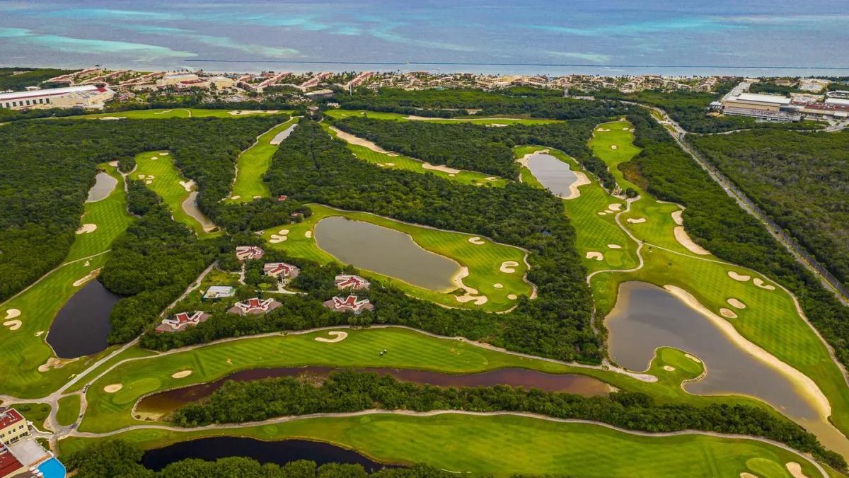 Overhead view of a golf course available from Palace Resorts