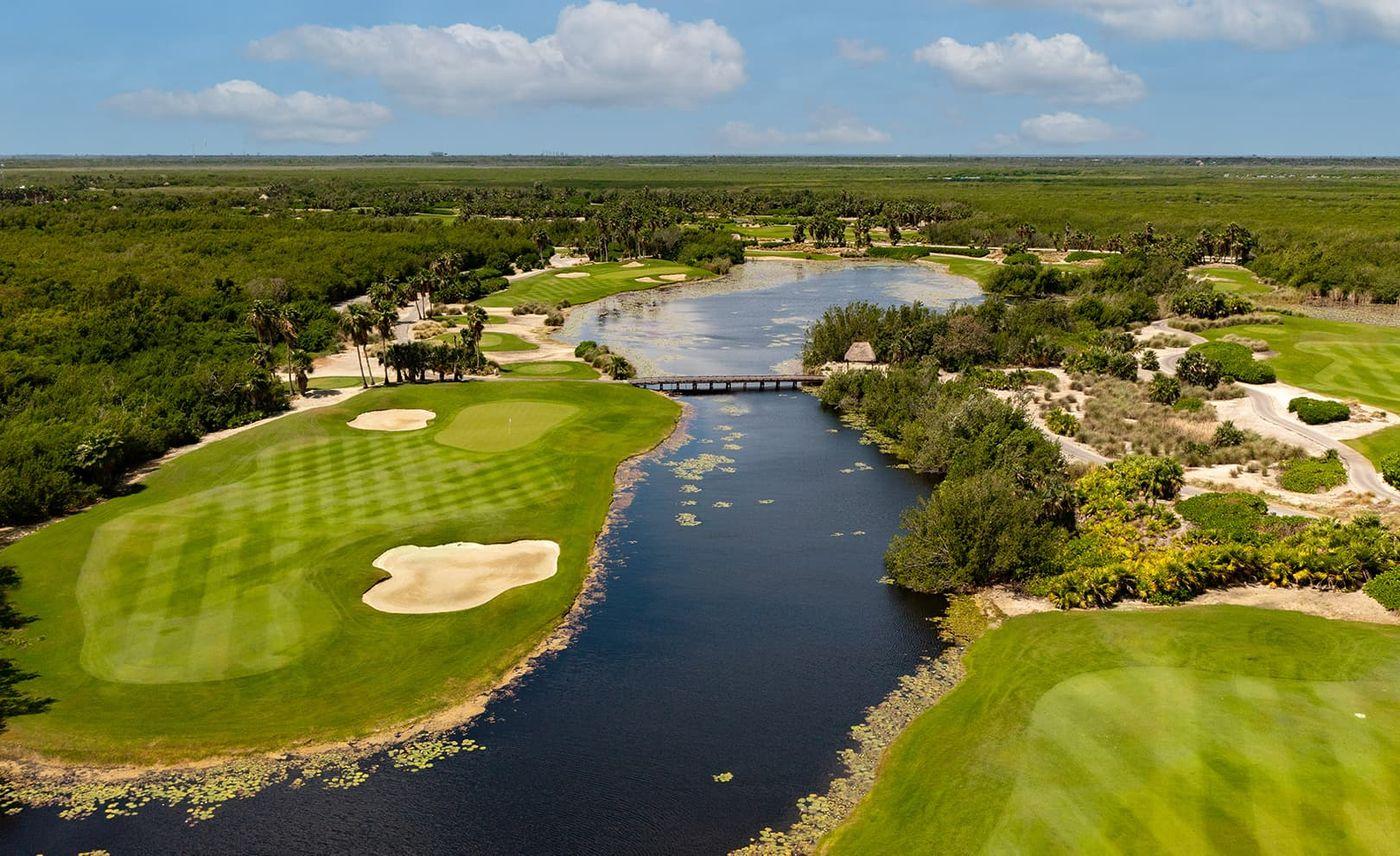 Overhead view of a water hazard running besides a fairway
