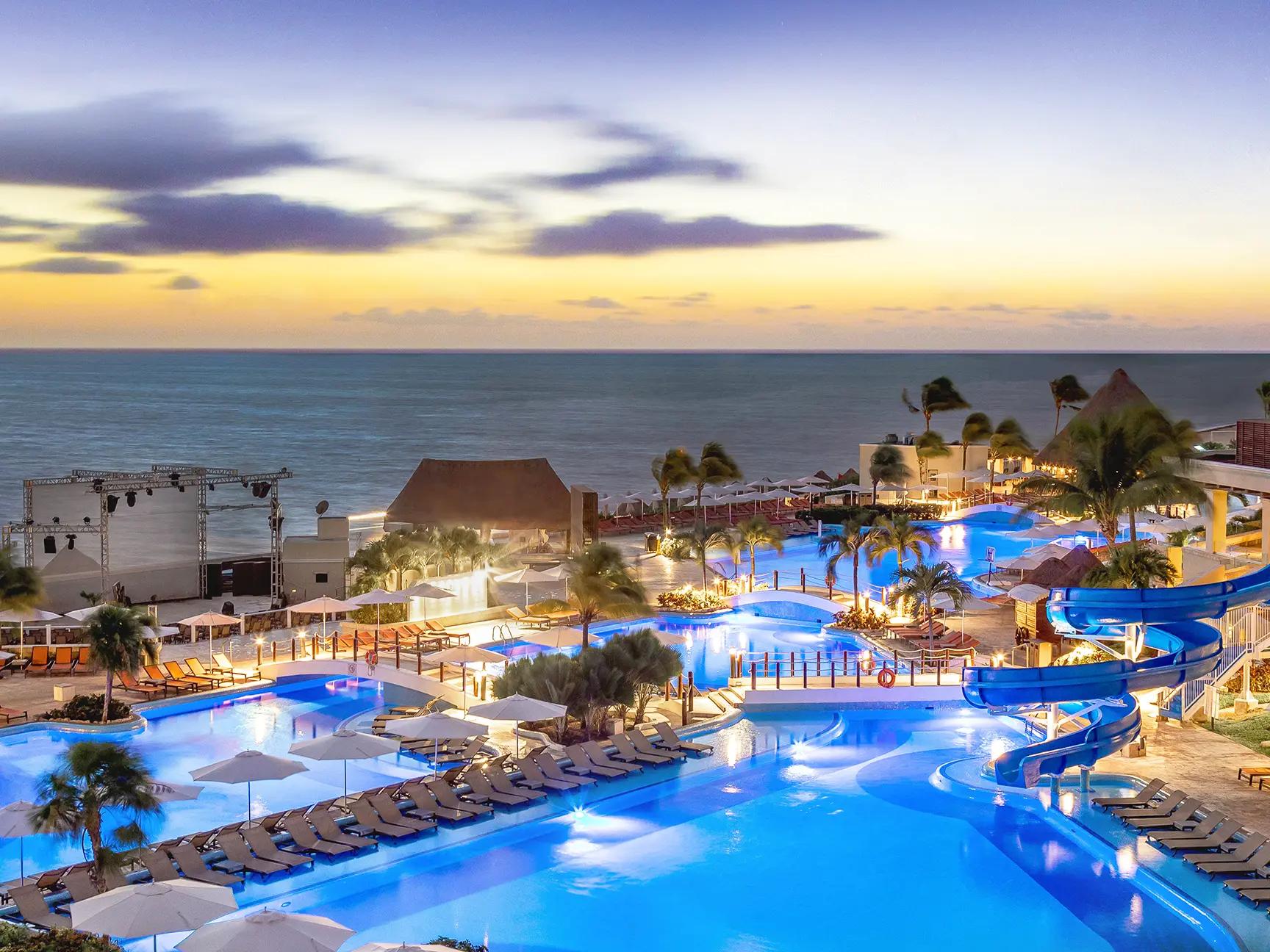 Overhead view of the Palace Resorts lit up at evening
