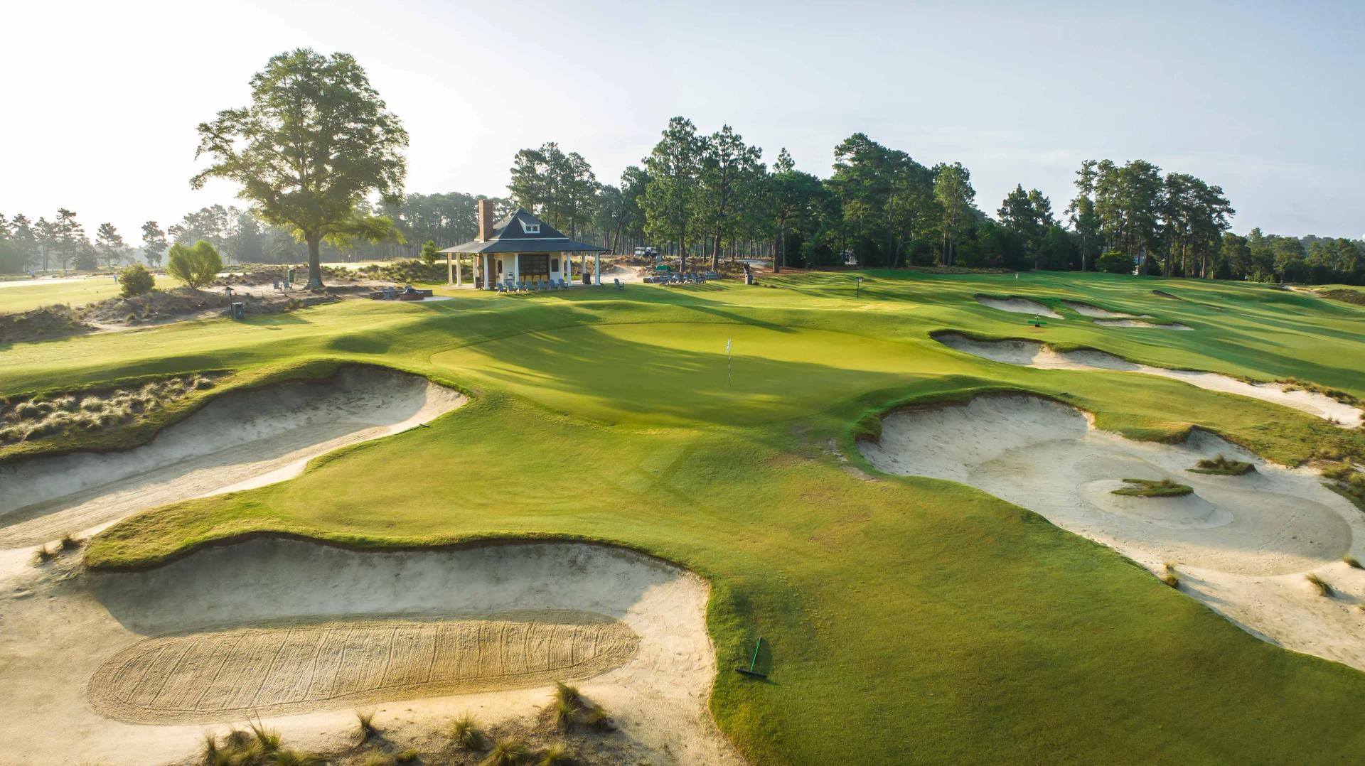 Overhead view of a well maintained fairway nestled with sand bunkers