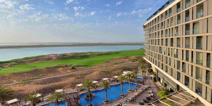 Overhead view of the outdoor swimming pool at Radisson Blu Hotel Abu Dhabi Yas Island
