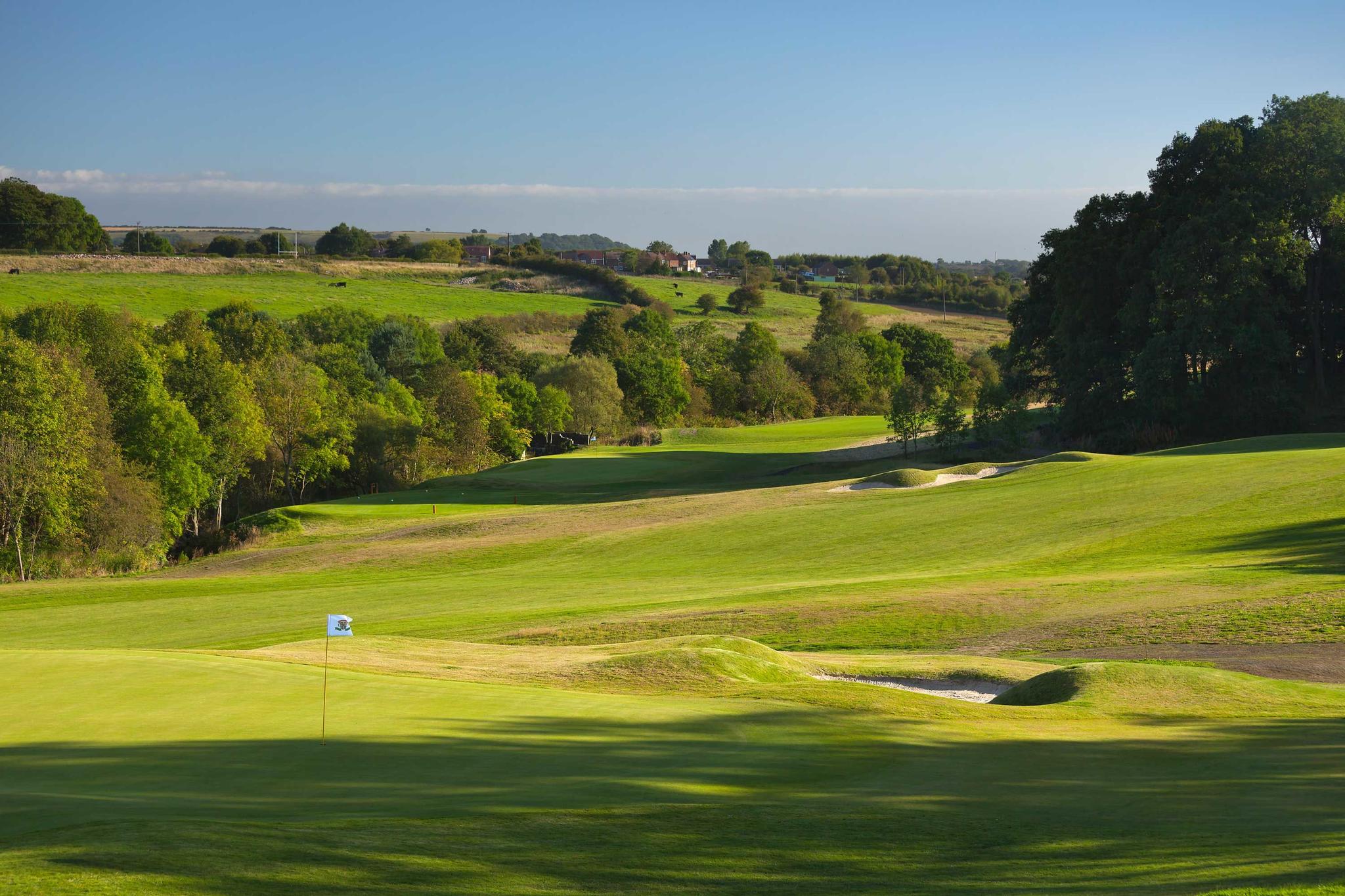 A well maintained fairway nestled with sand bunkers at the Ramside Hall Hotel, Golf & Spa