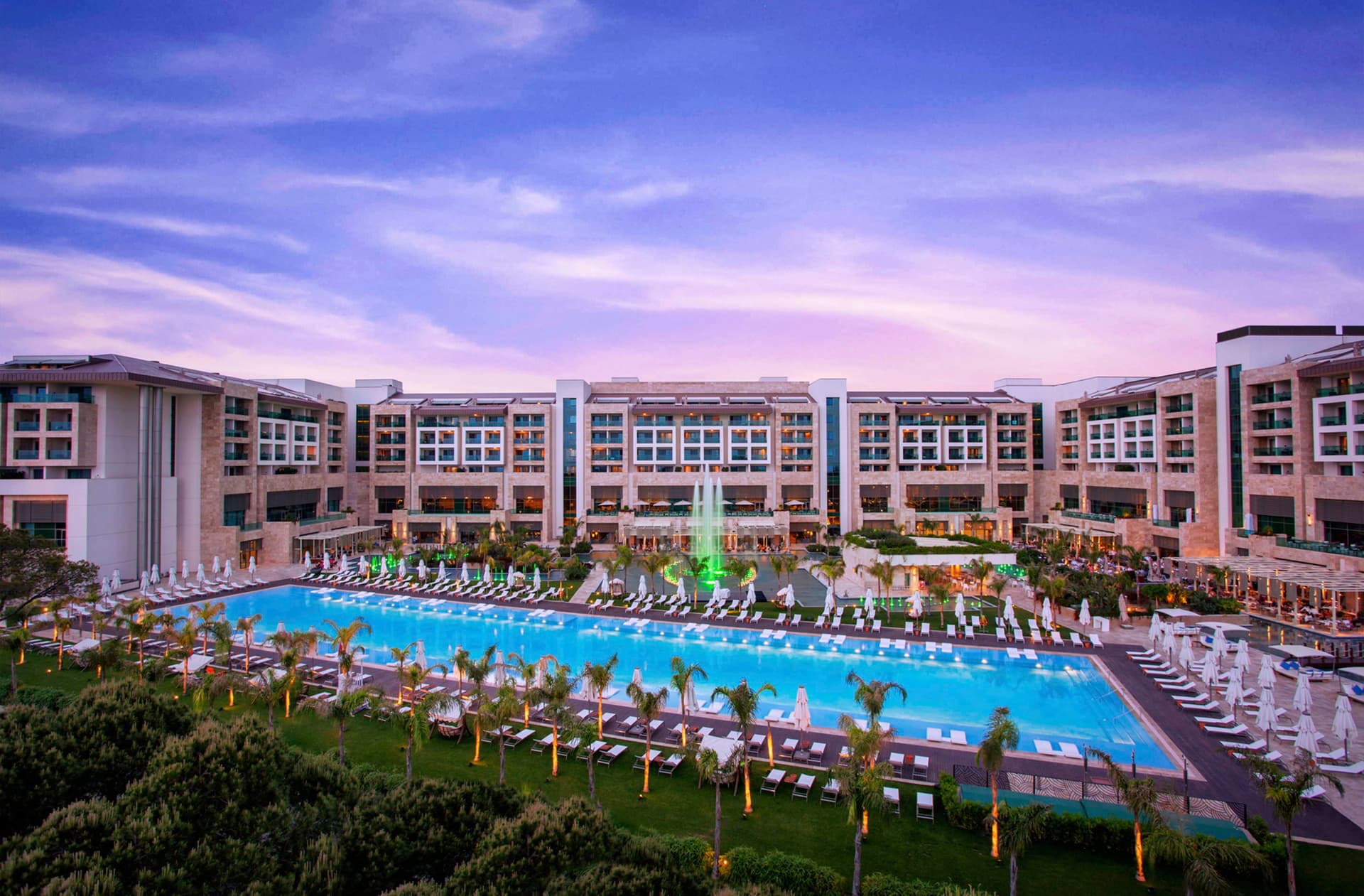 Panoramic view of the Regnum Carya Golf & Spa Resort outdoor swimming pool