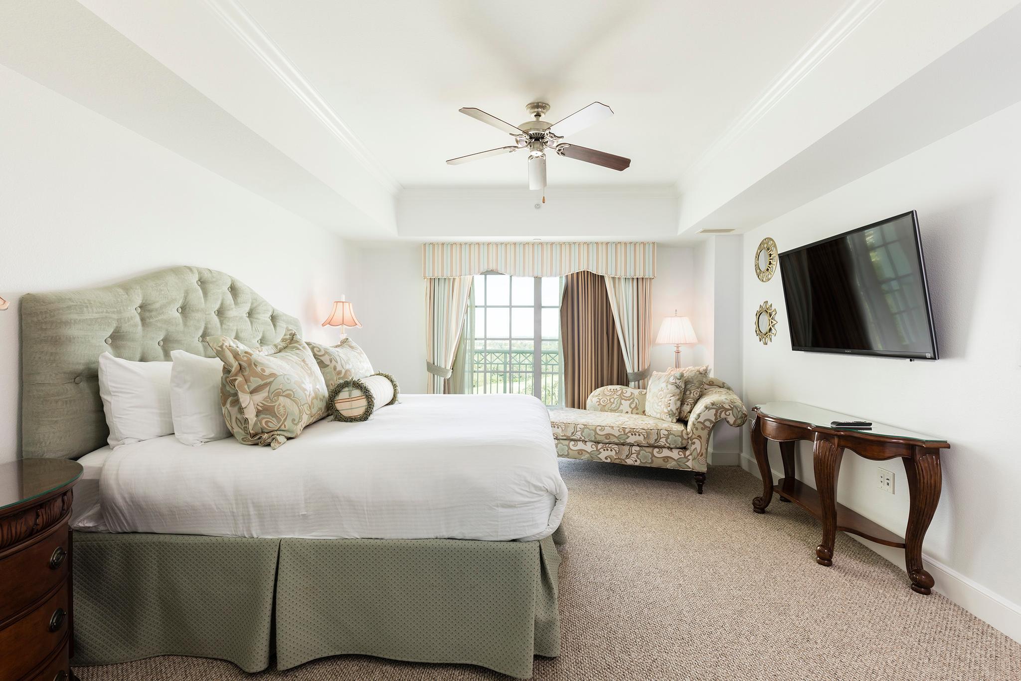 Double bed suite with a tv on the wall
