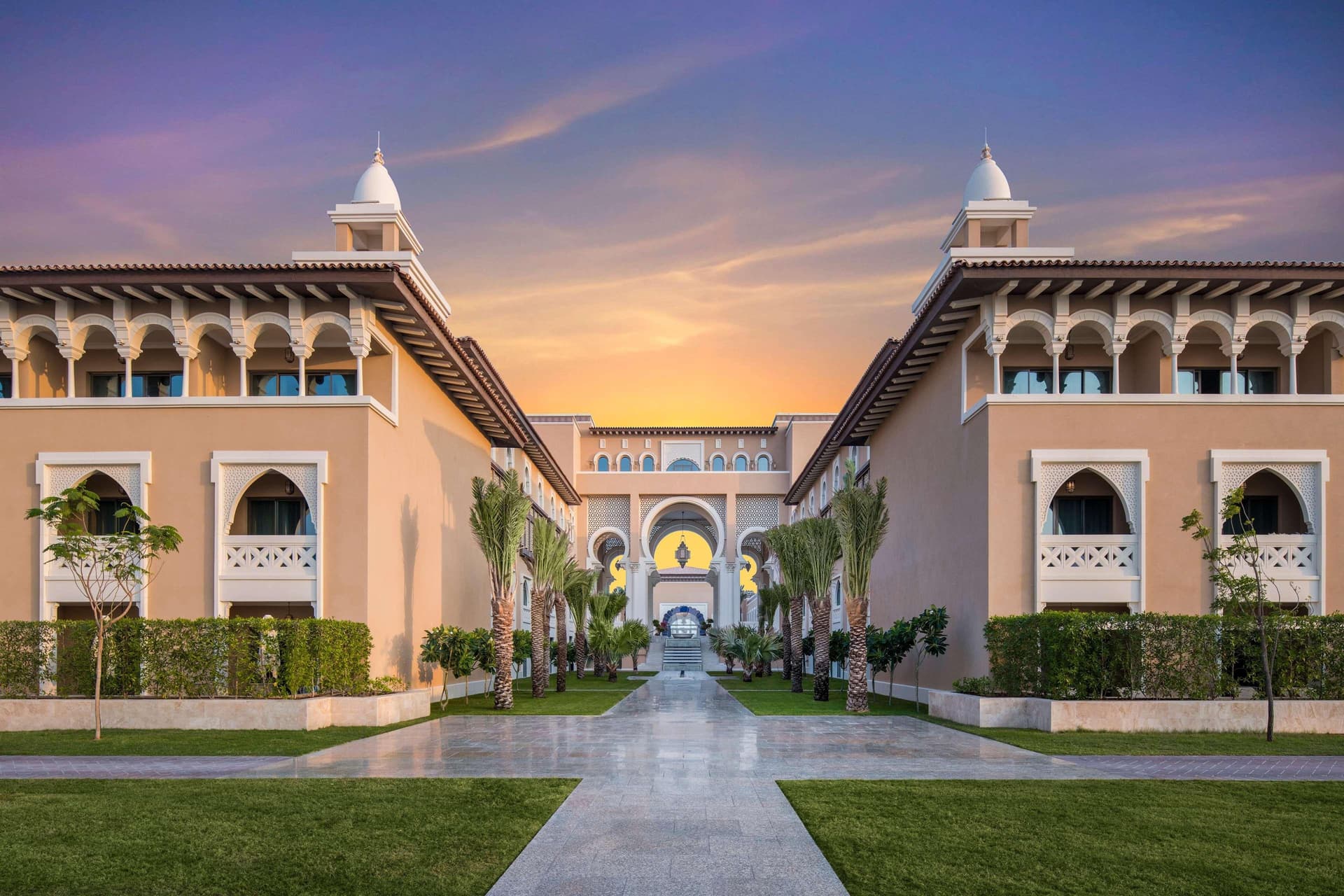 The Rixos Premium Saadiyat Island with the sun setting behind
