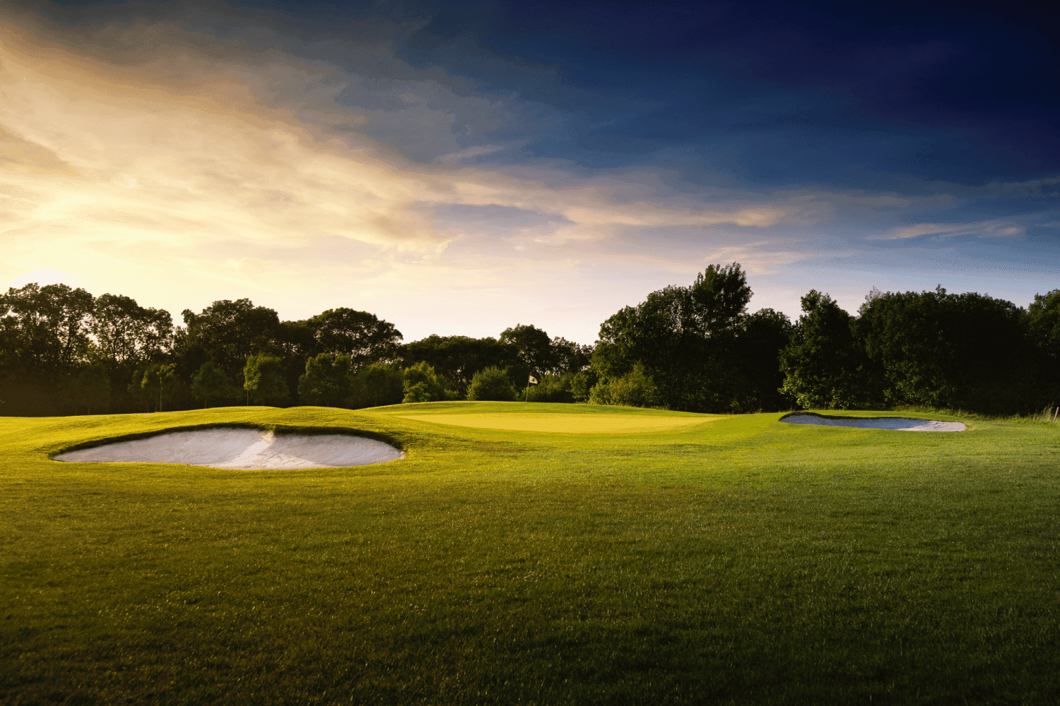A strategically placed sand bunker next to a smooth green