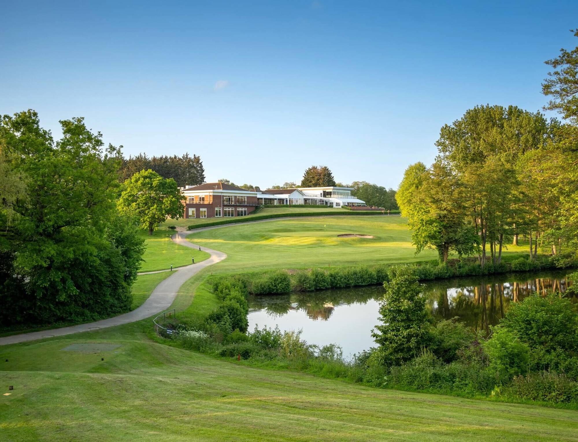 Fairway leading over a water hazard towards the green