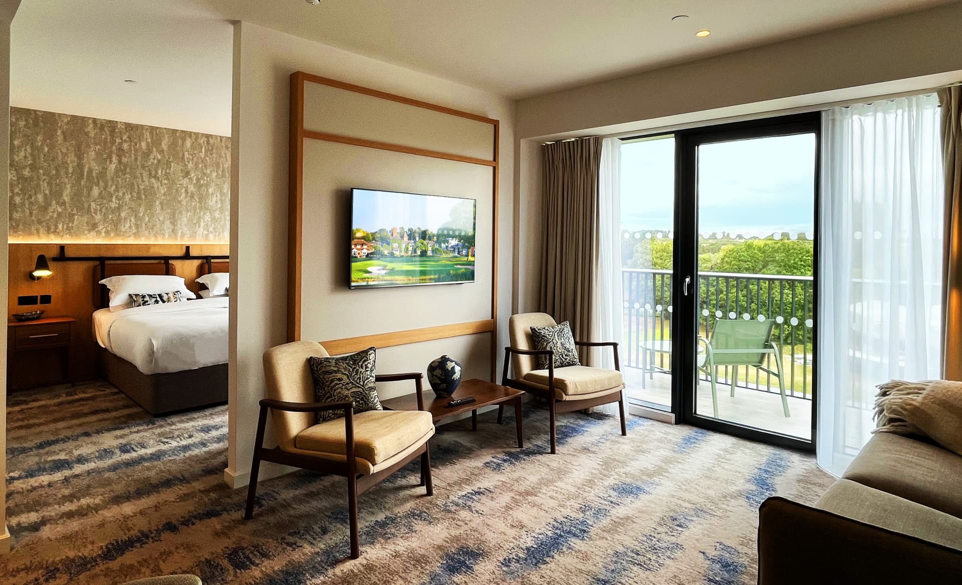 Living room with balcony as part of a double bed suite at The Belfry Hotel & Resort