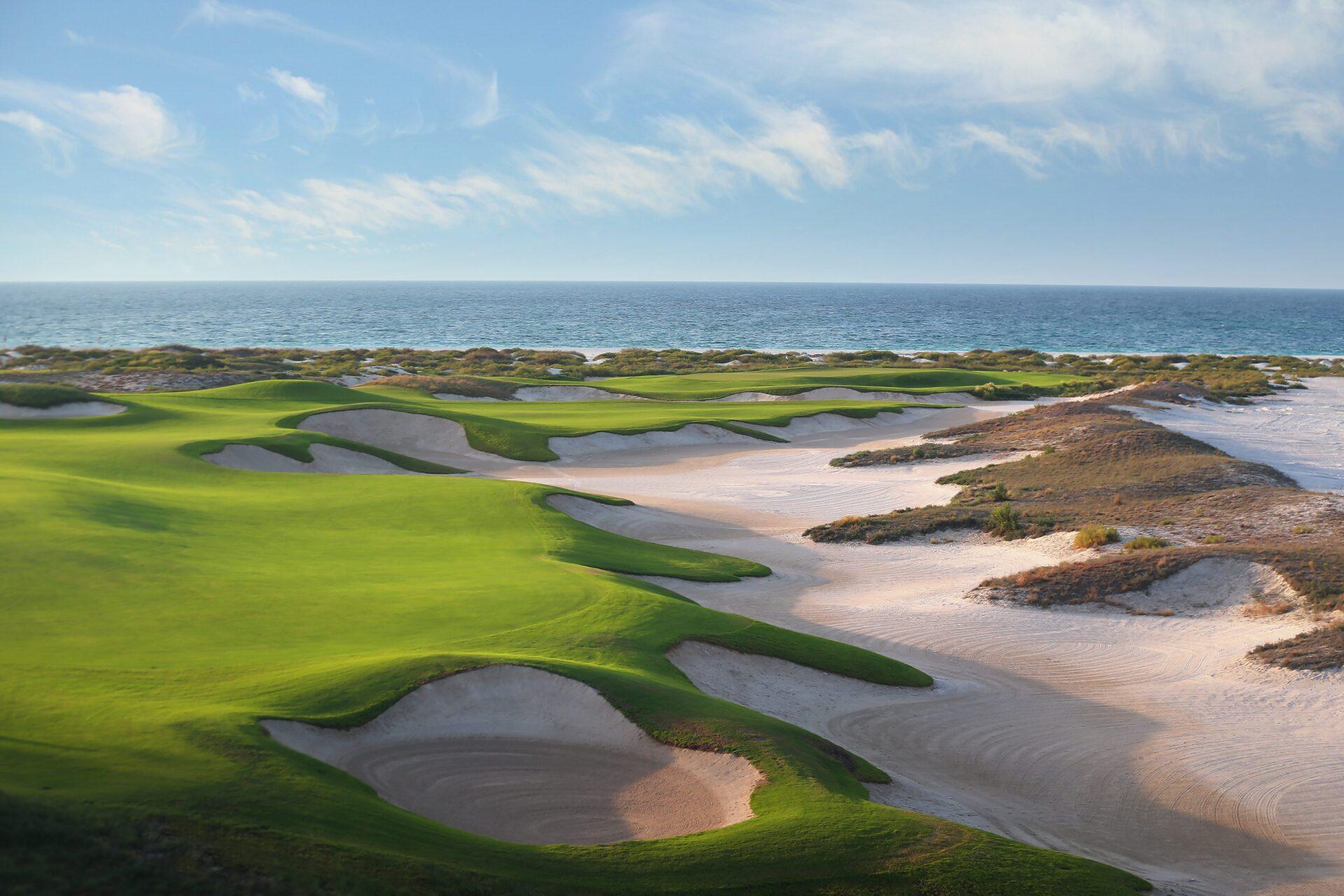 A well maintained fairway with large sand bunkers