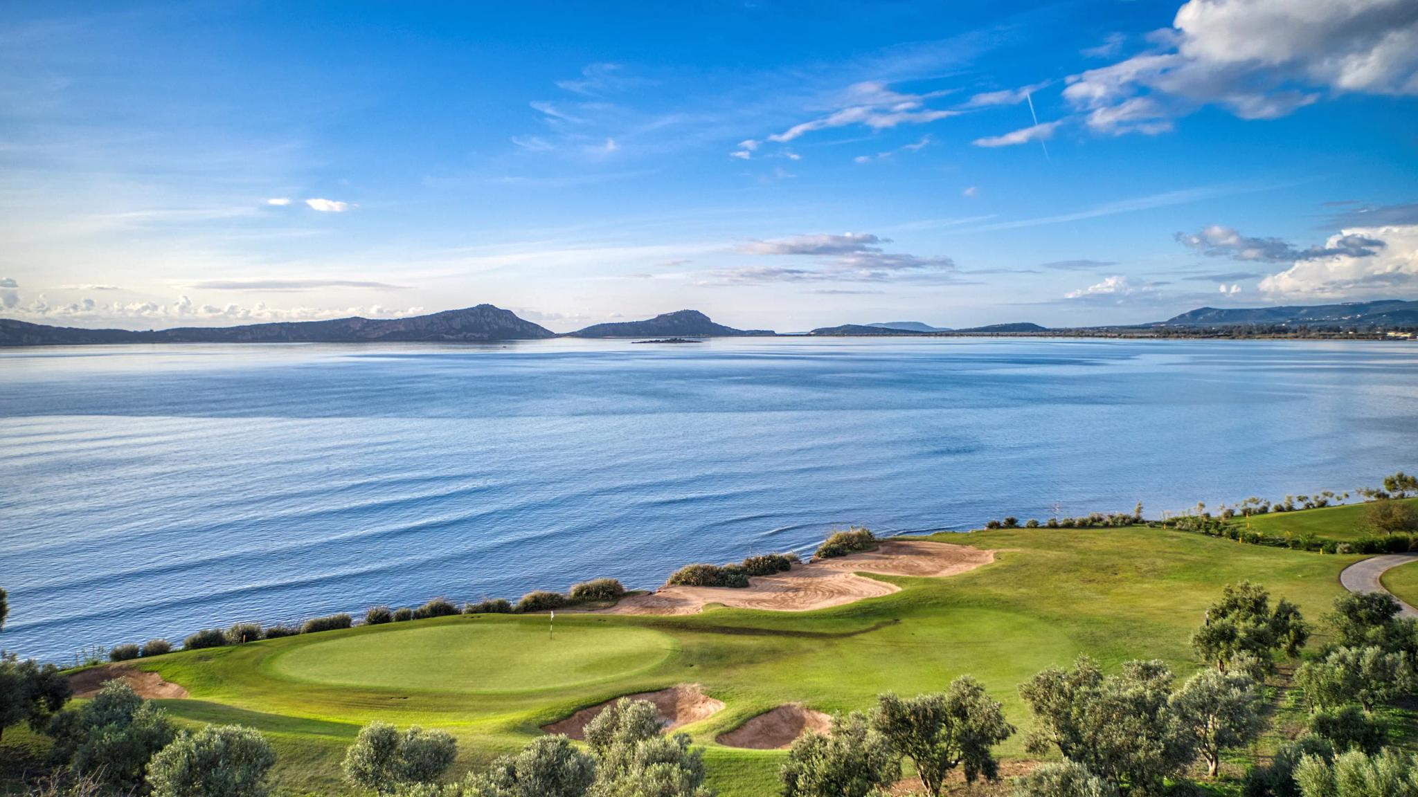 Overhead view of a smooth coastal green with a sand bunker