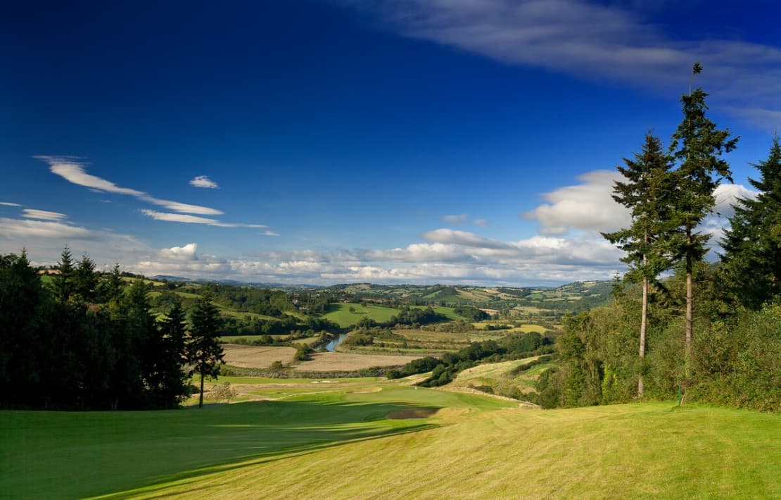 A well maintained fairway leading to a smooth green