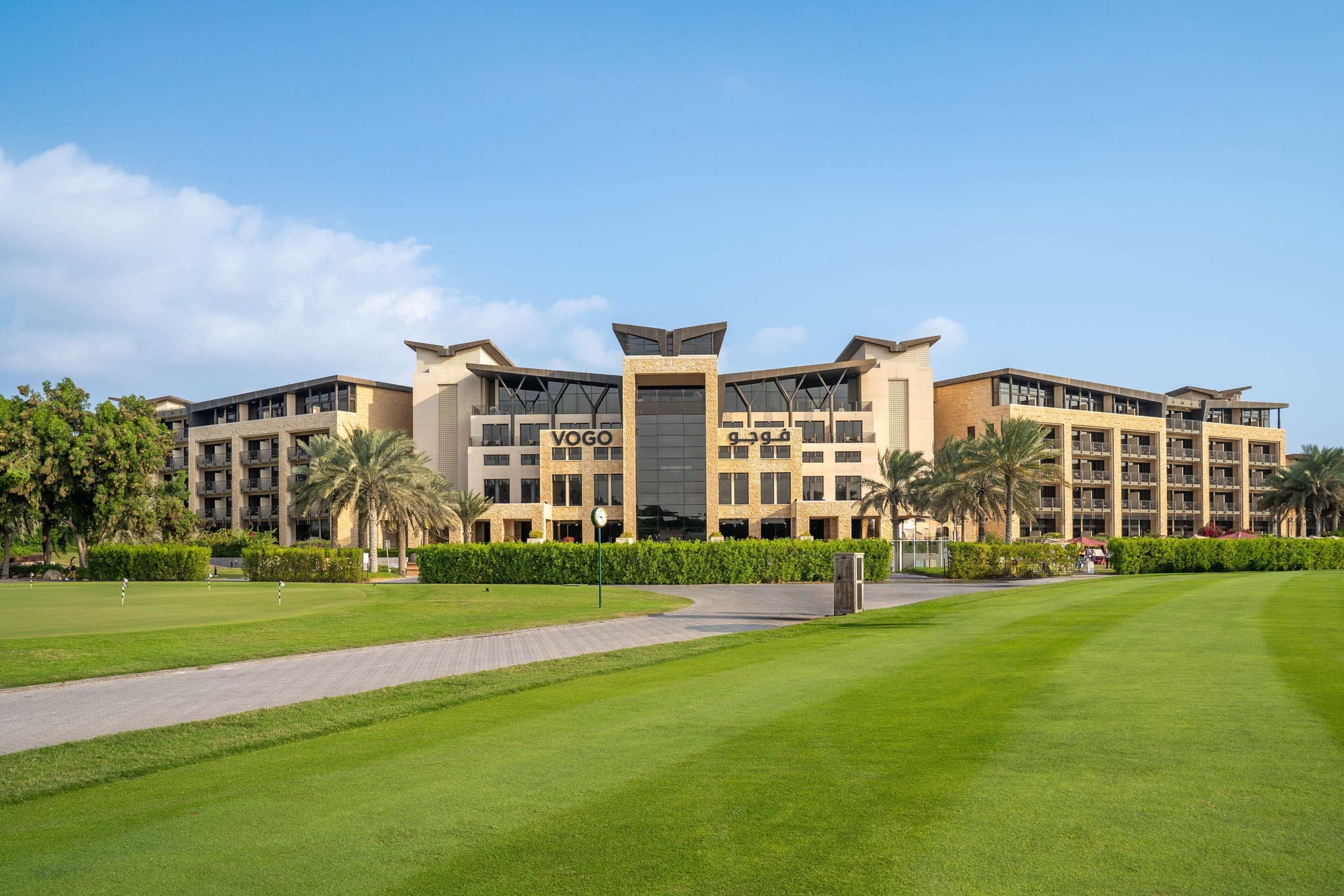 The VOGO Abu Dhabi Golf Resort & Spa clubouse overlooking the course