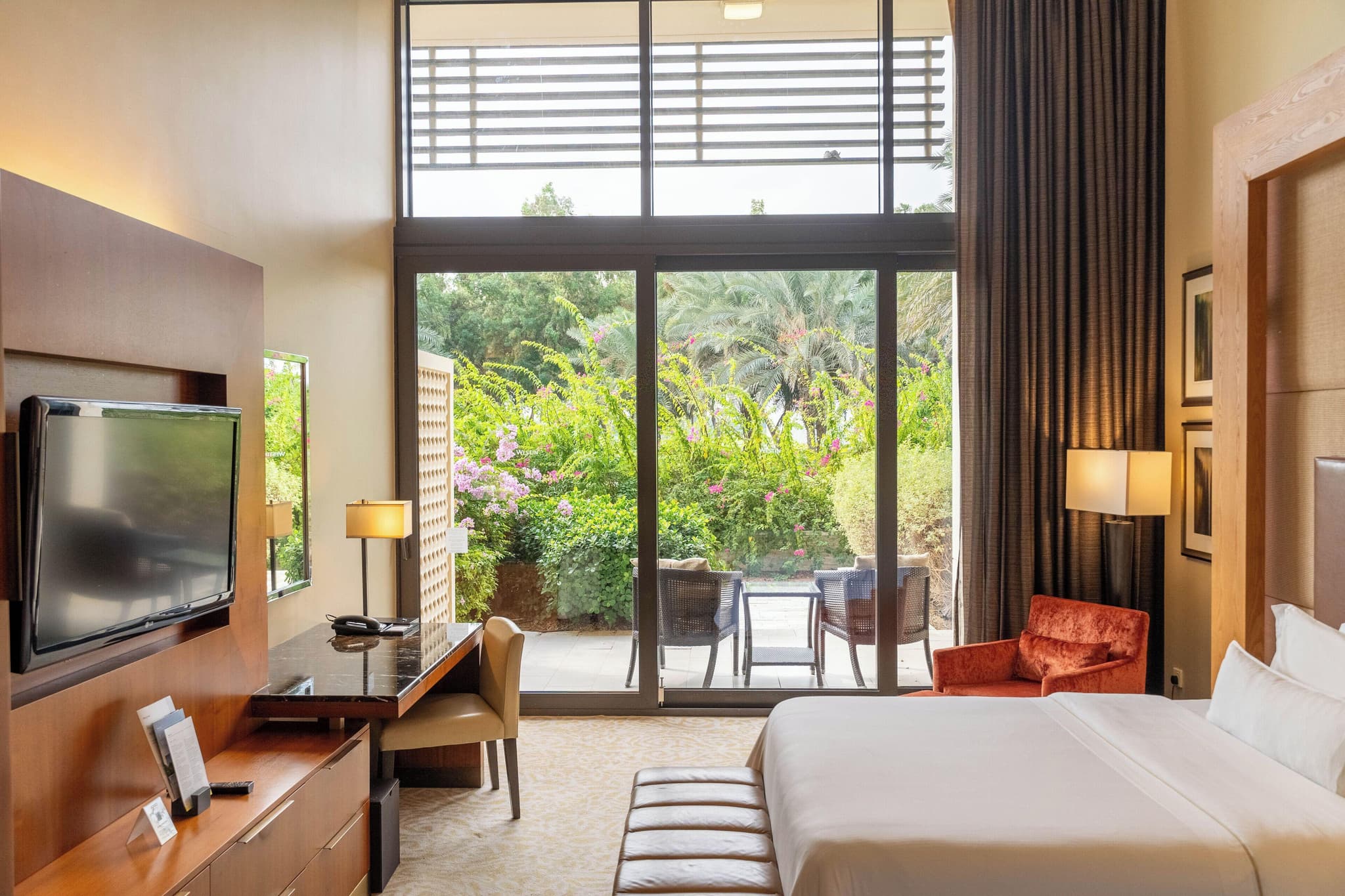 Double bed suite with a patio space at VOGO Abu Dhabi Golf Resort & Spa