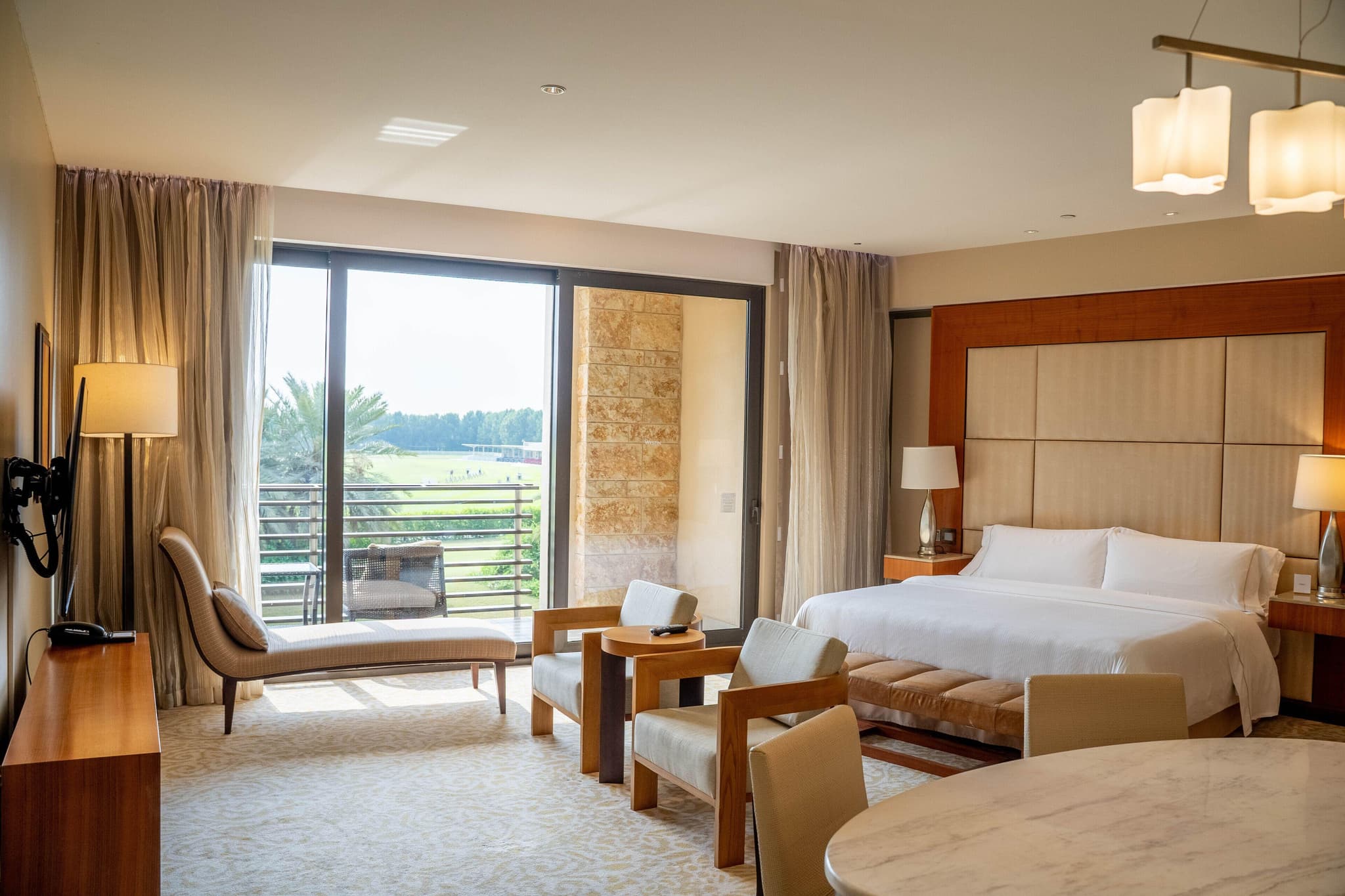 Double bed suite with balcony views at VOGO Abu Dhabi Golf Resort & Spa