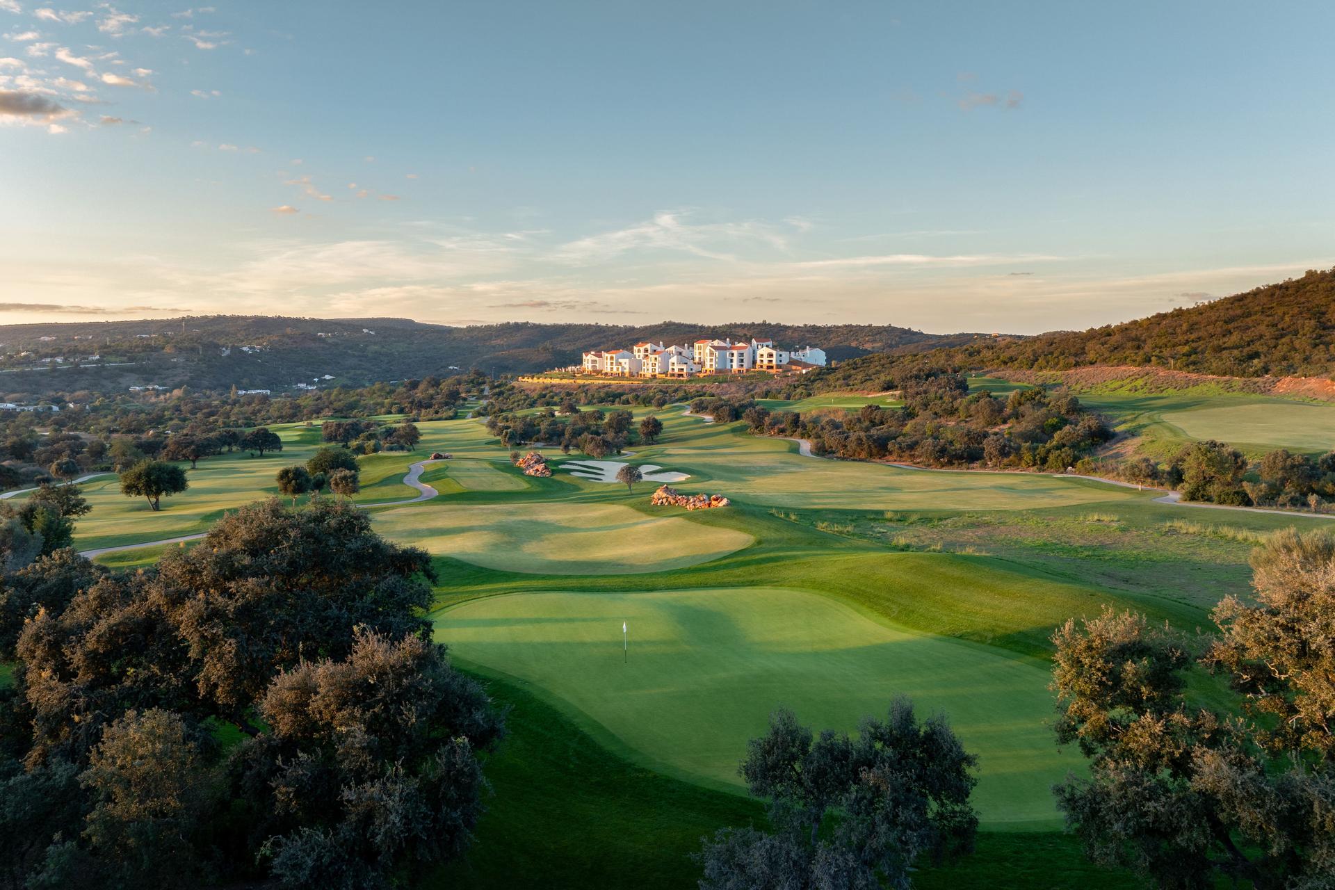 A well maintained fairway leading to a smooth green