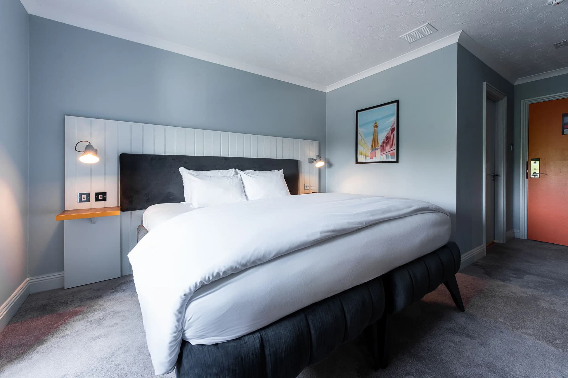 A modern double bed suite at the Village Hotel Herons Reach