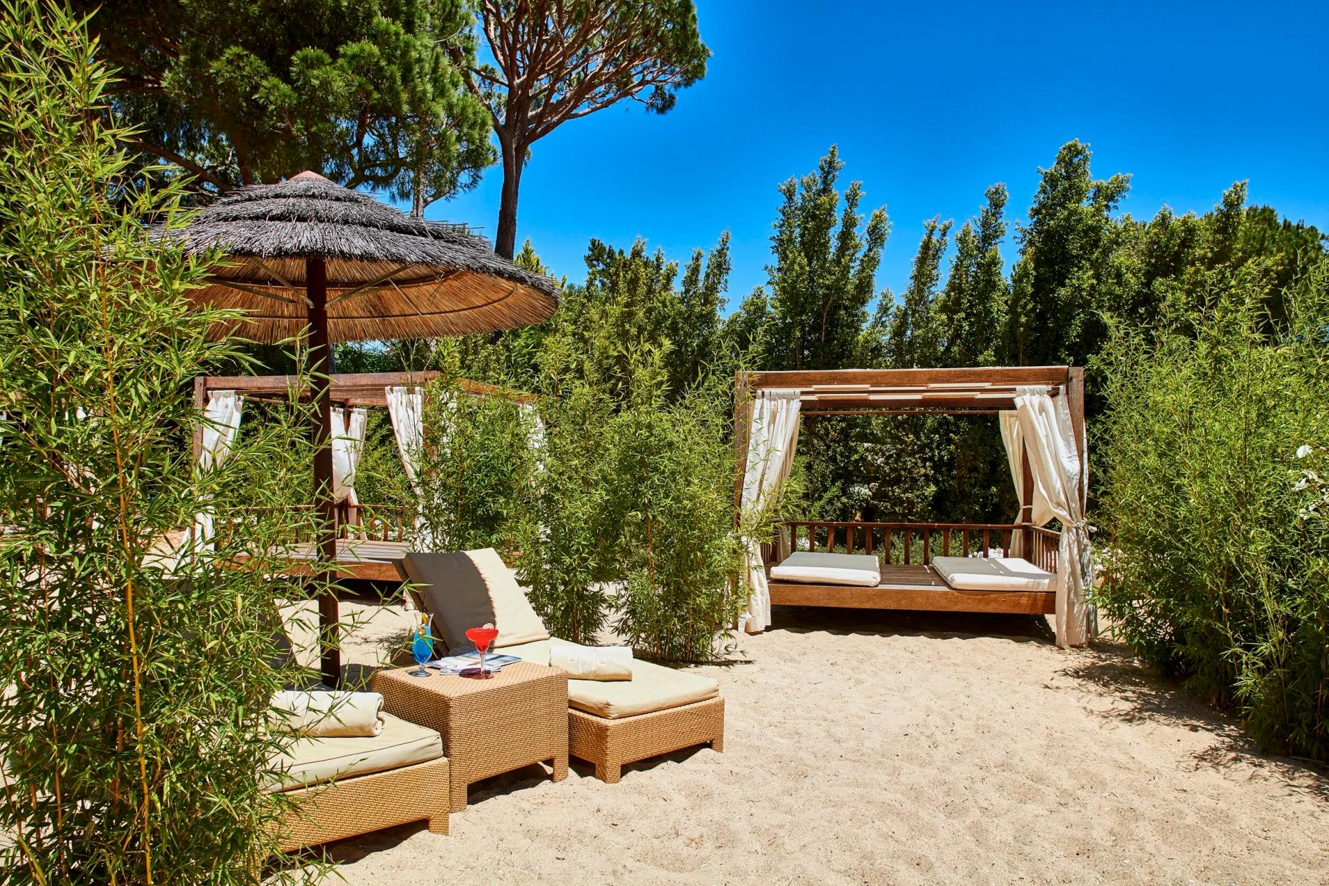 Outdoor cabanas ans sunbeds on the beach at Wyndham Grand Algarve