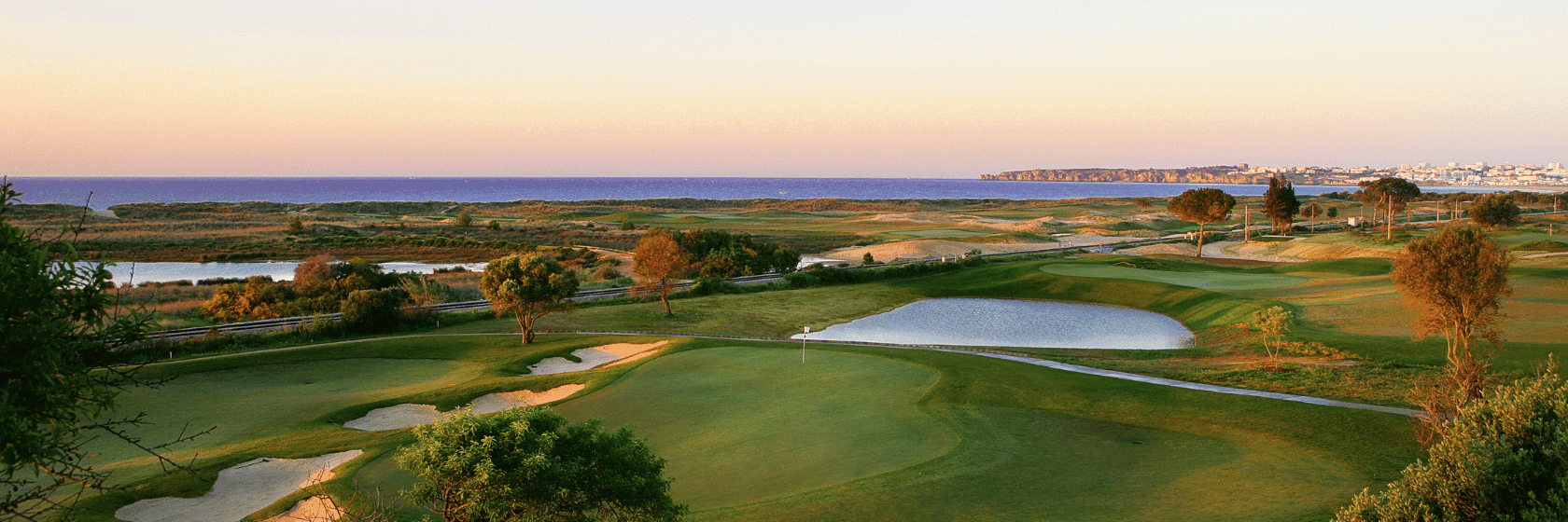 A well maintained fairway leading to a smooth green