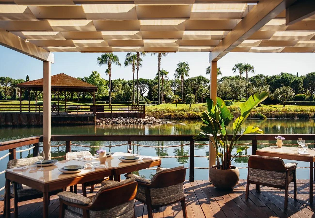 Outdoor dining area at Domes Lake Algarve, Autograph Collection
