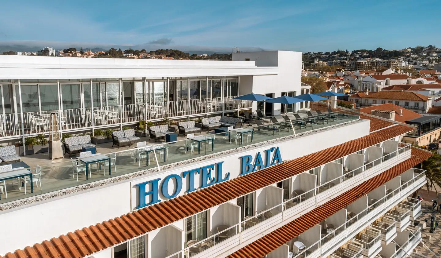 Overhead view of the rooftop bar alongside the Hotel Baia sign