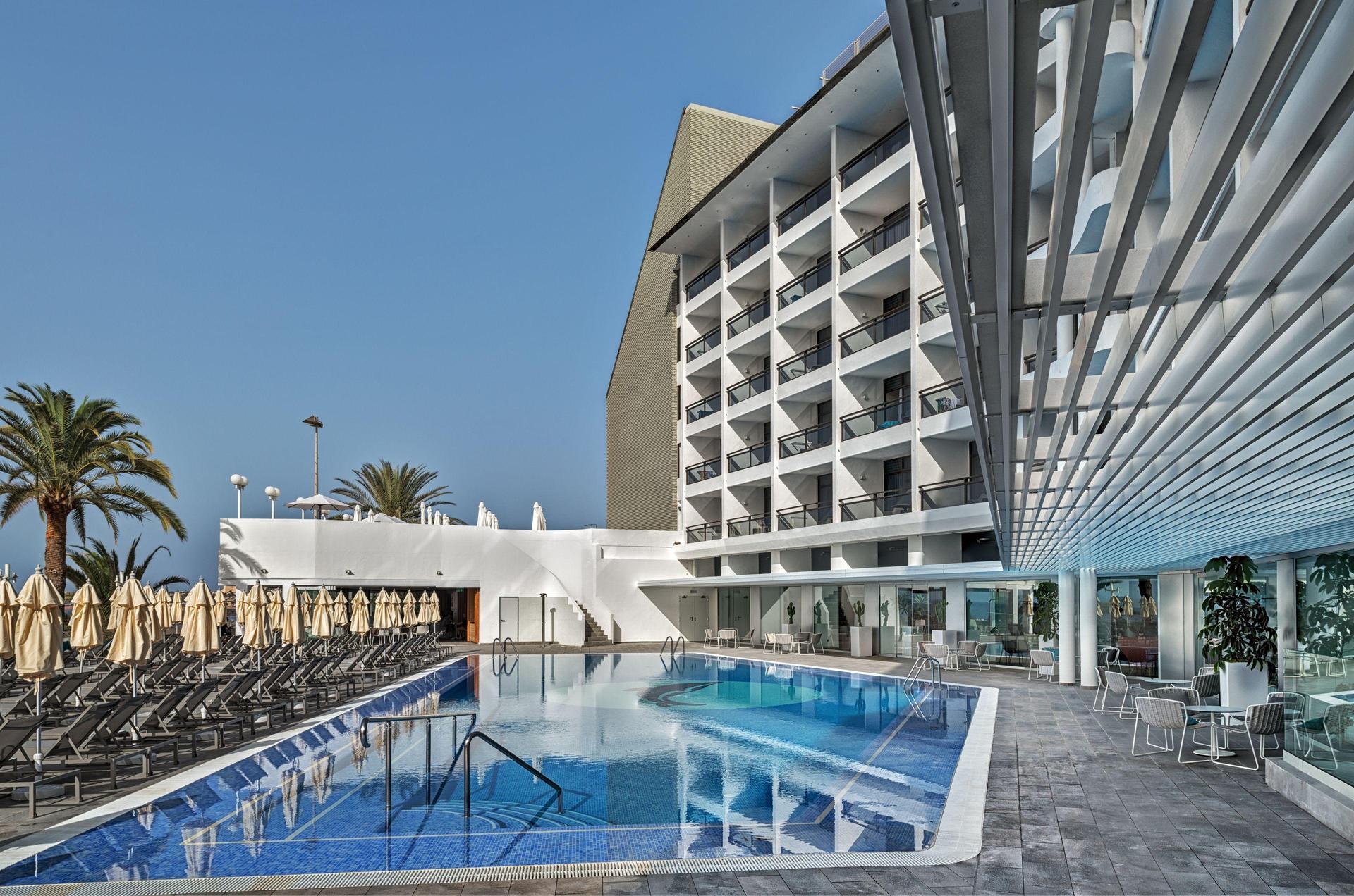 The Hotel Don Gregory by Dunas building overlooking the outdoor pool