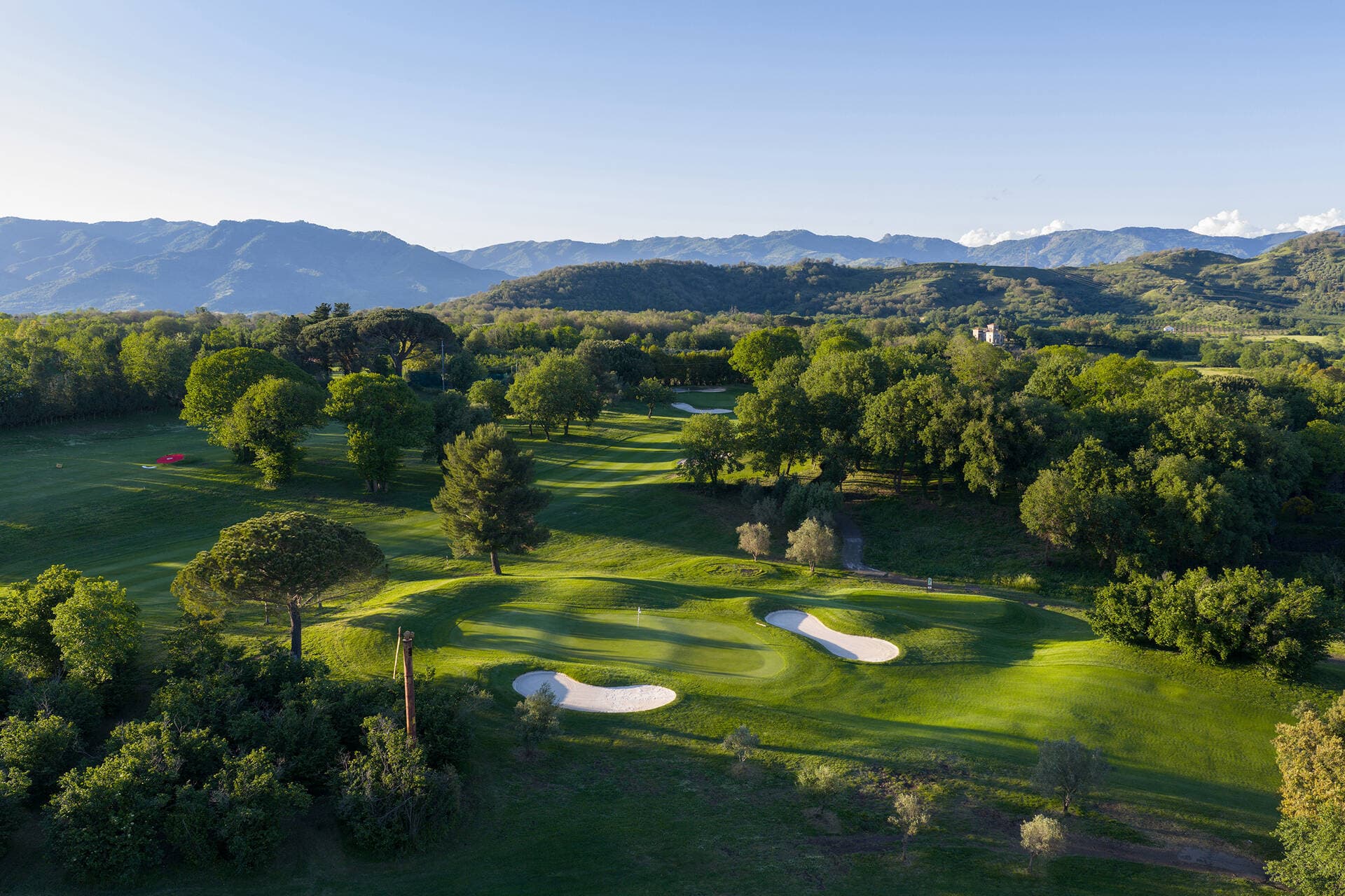 Overhead view of a well maintained fairway leading to a smooth green