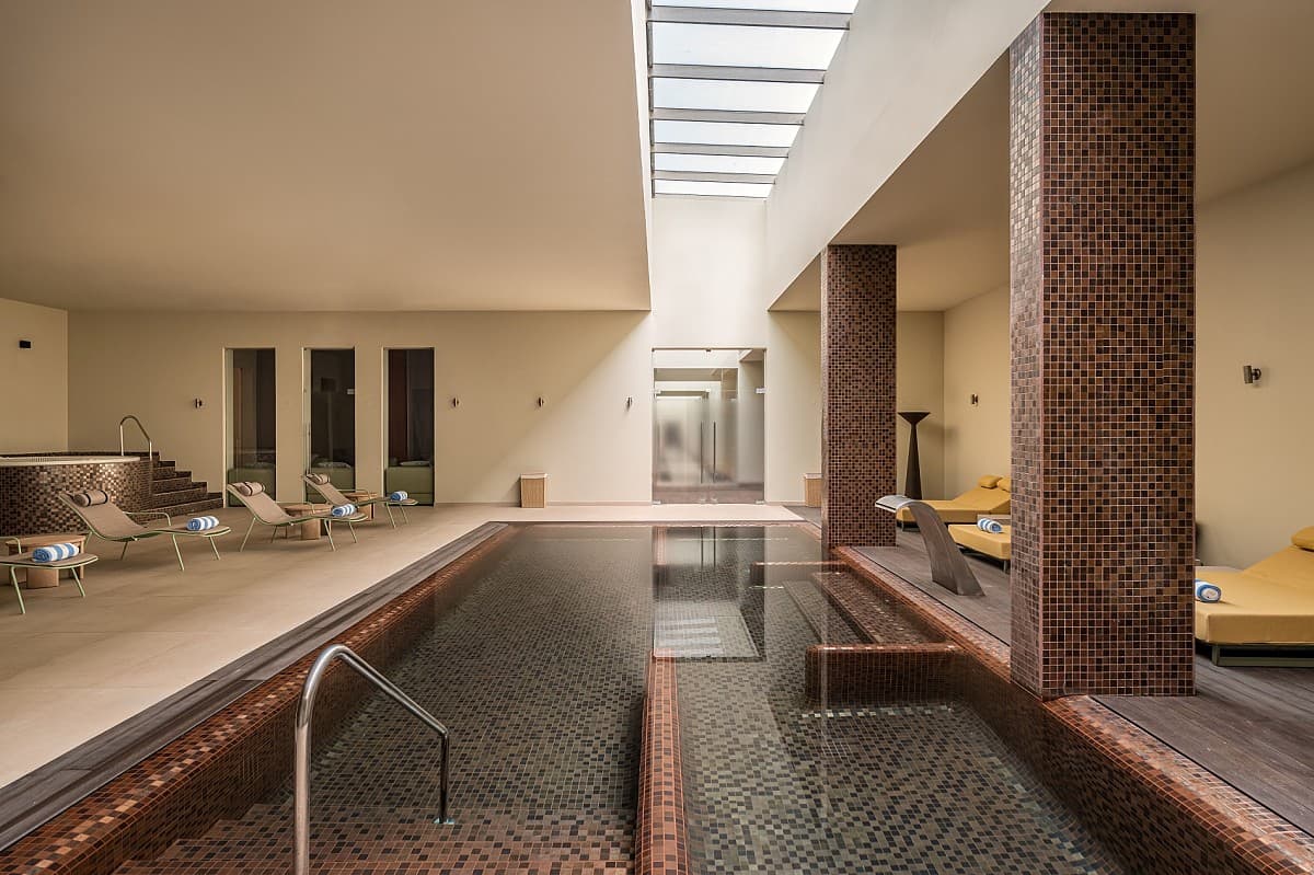 Indoor pool as part of spa facilities at Kimpton Atlantico Algarve