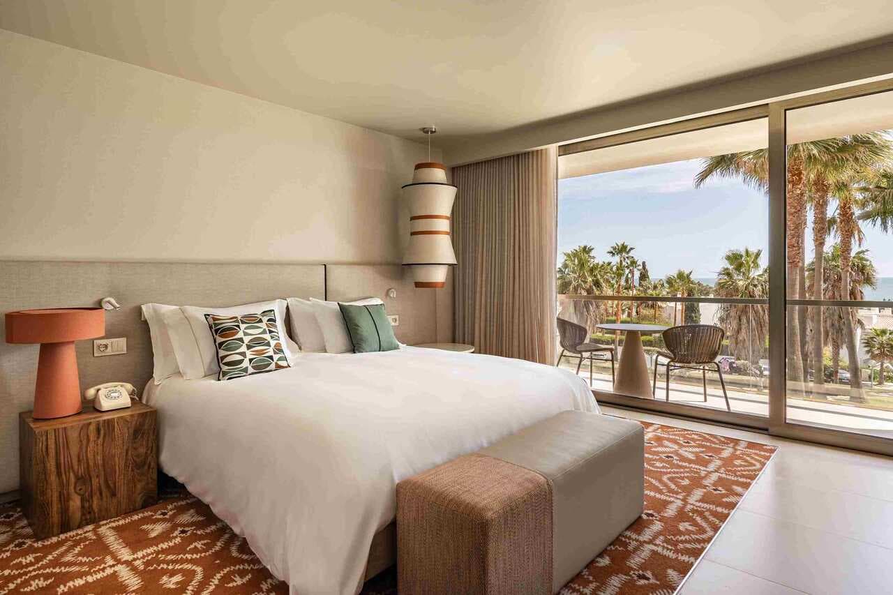 Double bed suite with balcony views at Kimpton Atlantico Algarve