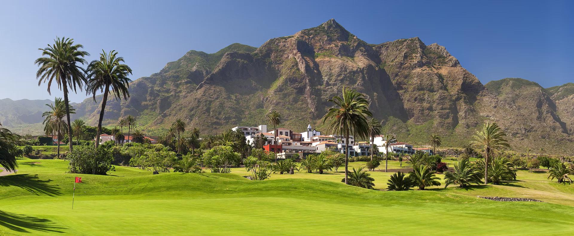 A well maintained fairway with mountain views