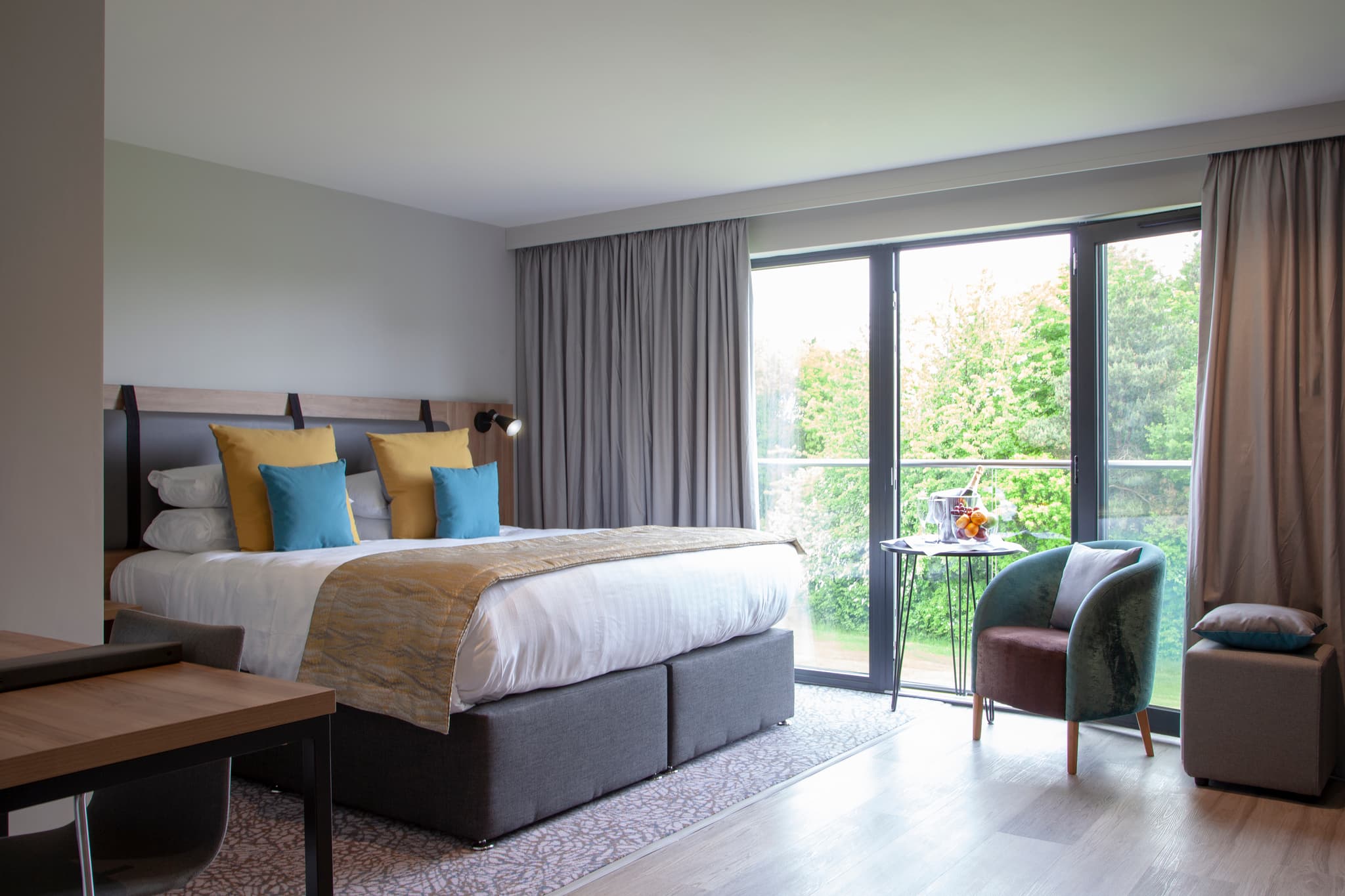 Double bed suite with a patio space at Mercure George Washington Hotel Golf and Spa