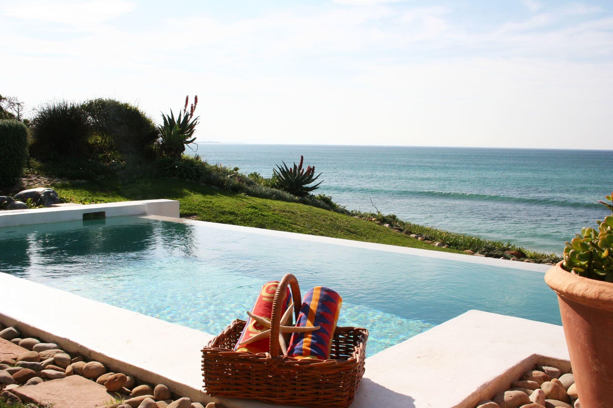 Outdoor swimming pool with coastal views at The Sands at St. Francis Bay