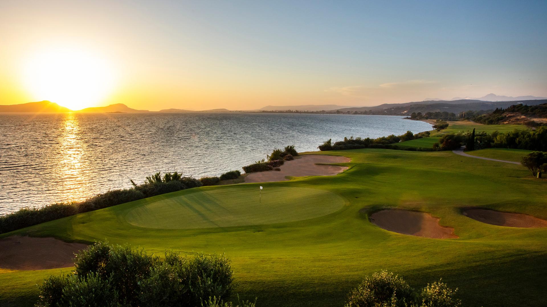 A smooth coastal green under the sunset at Costa Navarino