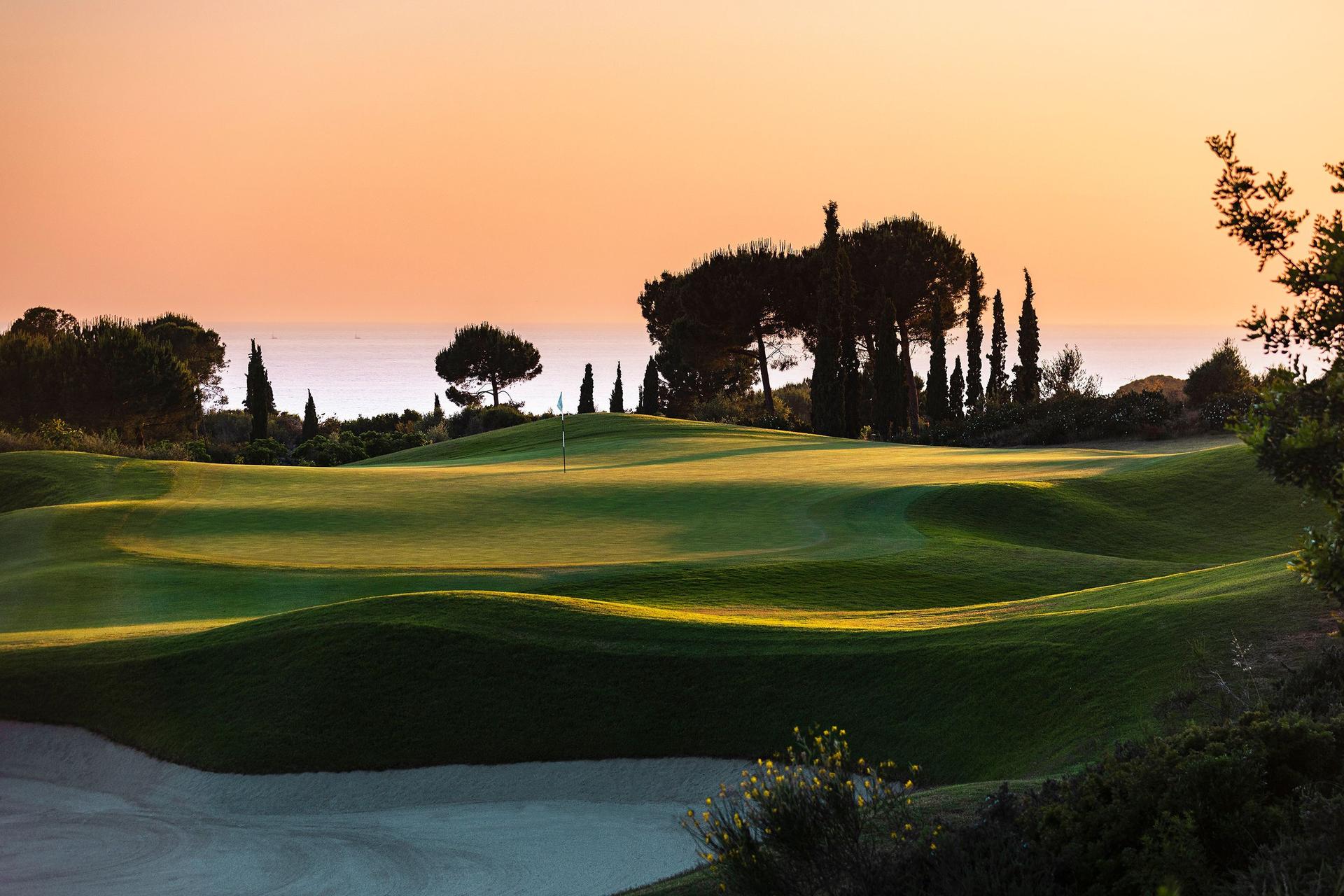 A well maintained fairway nestled with rolling dunes and sand bunkers