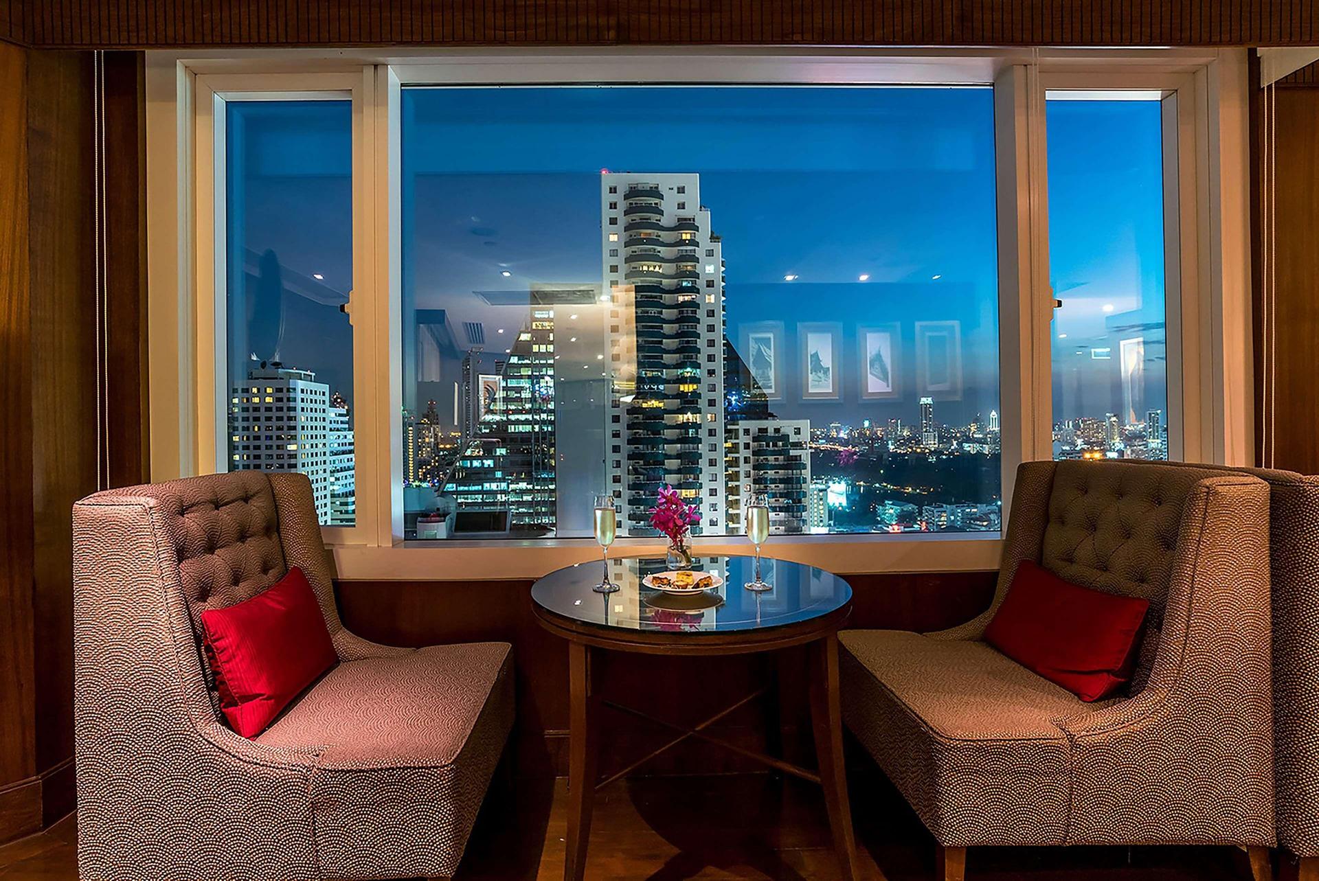 Dining area views of the city at Hilton Bangkok Grande Asoke